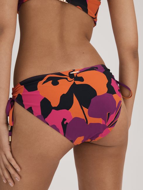 Florere Printed Ruched Bikini Bottoms in Pink/Orange