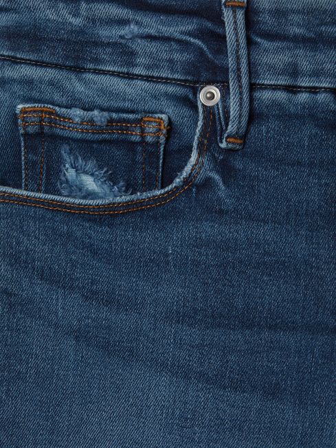 Good American Distressed Skinny Jeans in Indigo