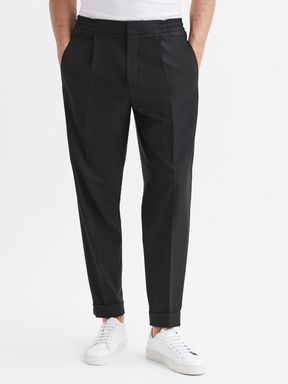 Relaxed Pleated Tapered Trousers in Black