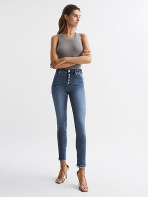 Good American Exposed Button Skinny Jeans in Indigo