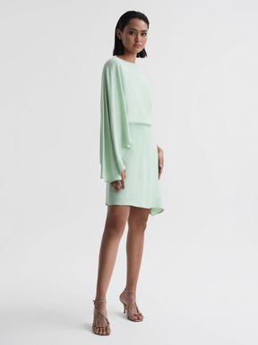 Sage Reiss Christy Cape Sleeve Asymmetric Mini Dress