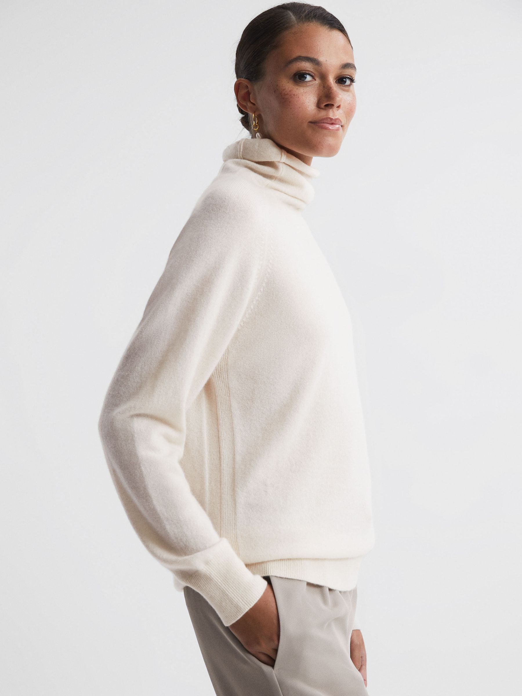 Relaxed Cashmere Roll Neck Top in Cream - REISS