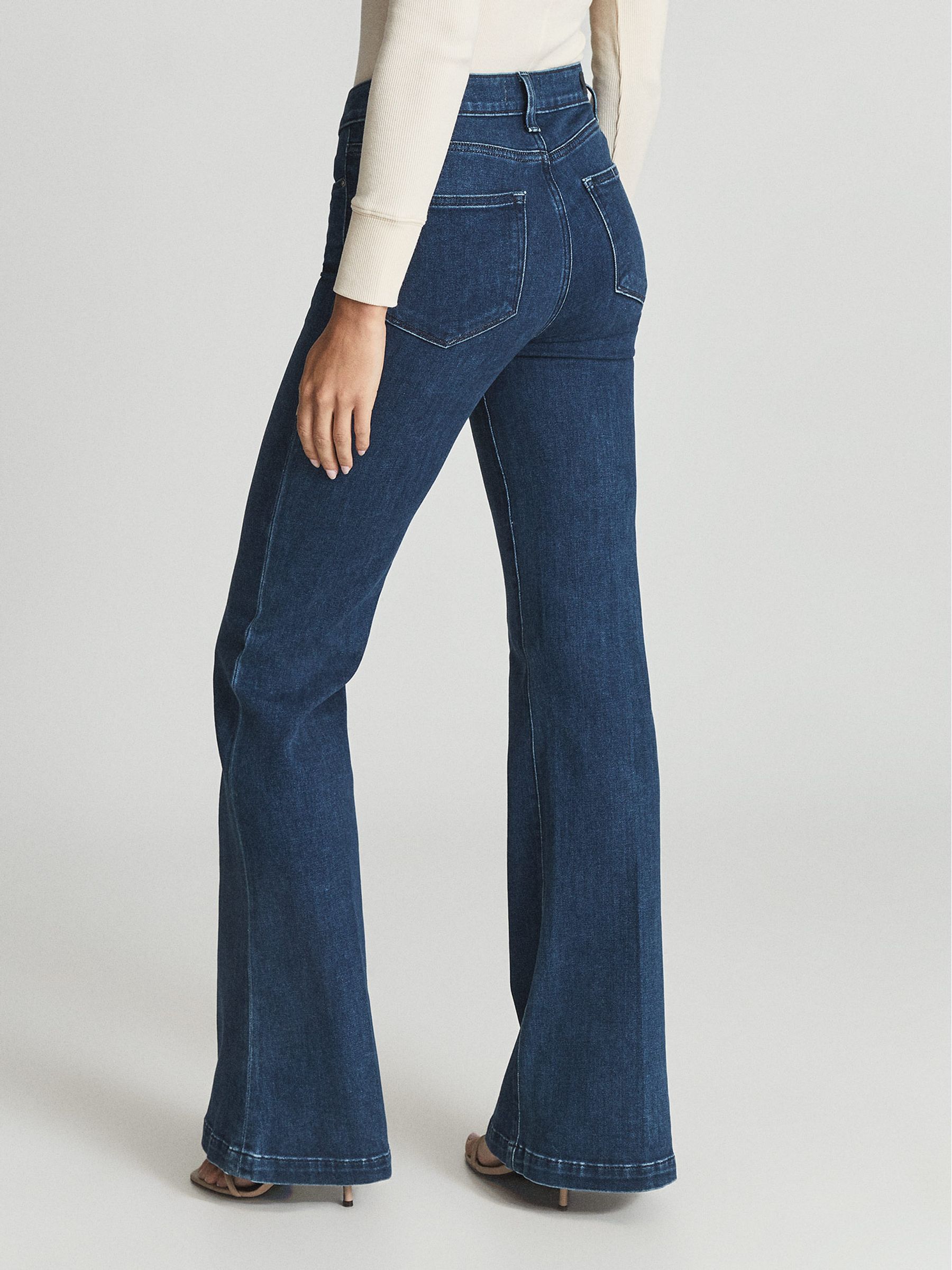 Paige High Rise Flared Jeans in Mid Blue - REISS