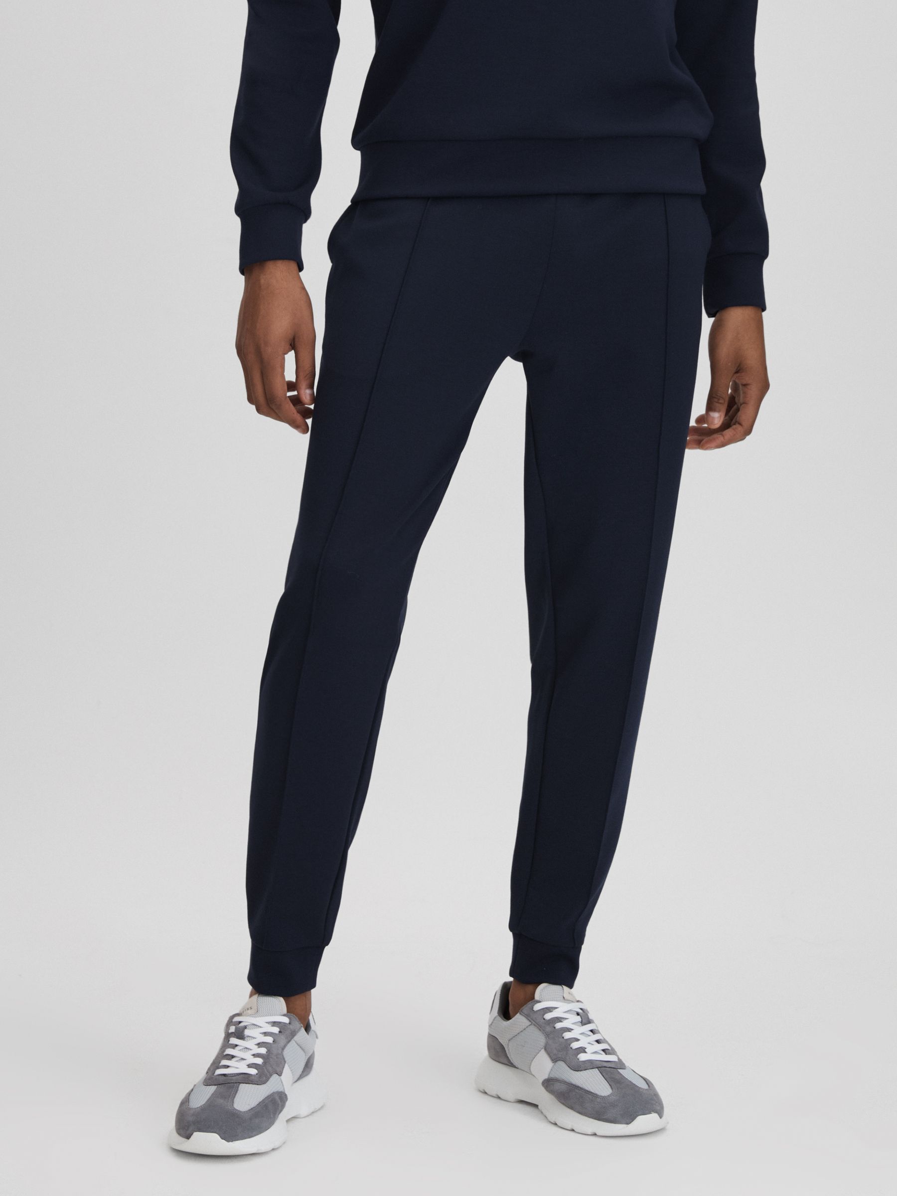Reiss Castore Jersey Tapered Joggers in Midnight Navy REISS
