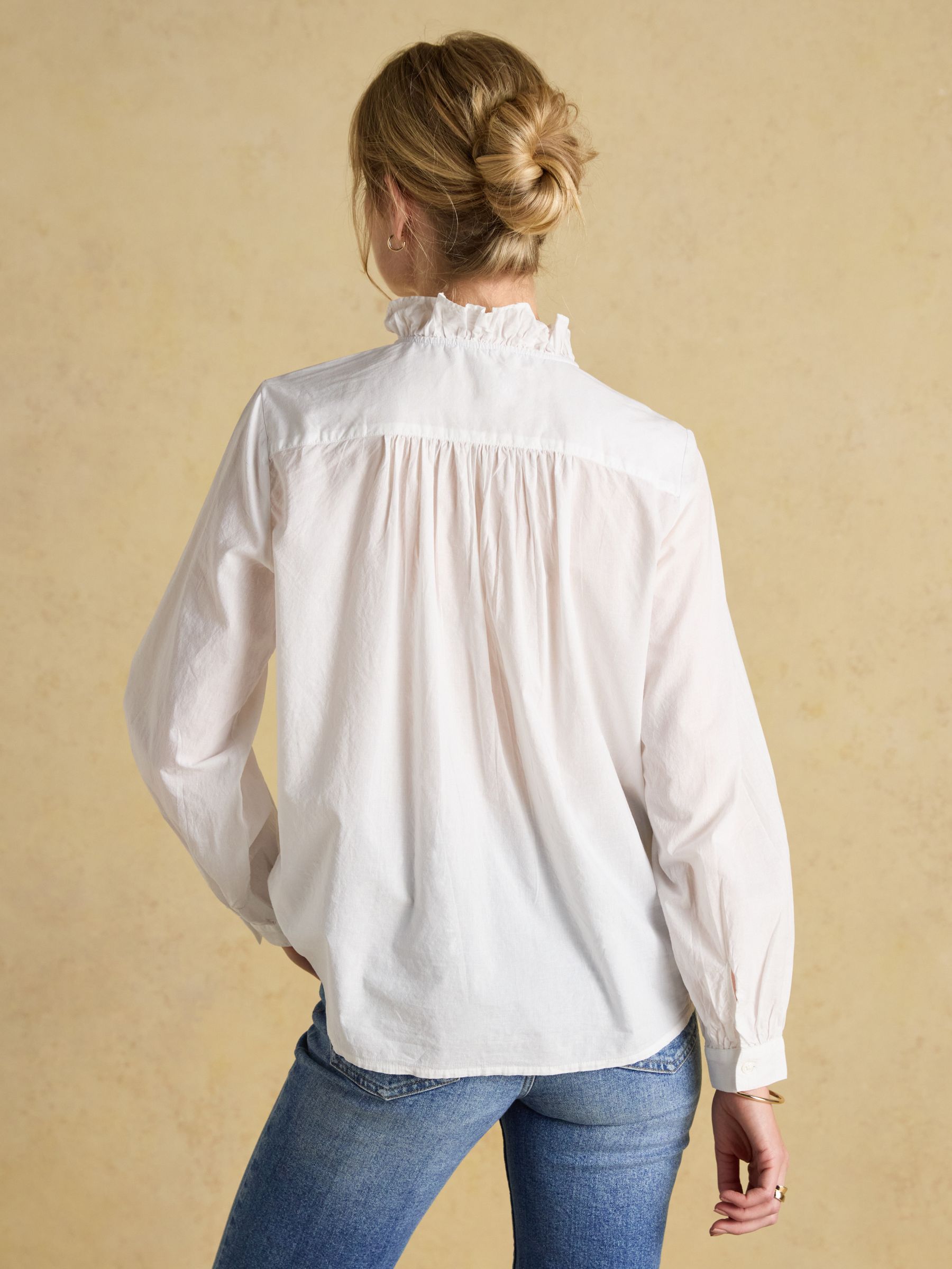 White cotton blouse with ruffles on sale