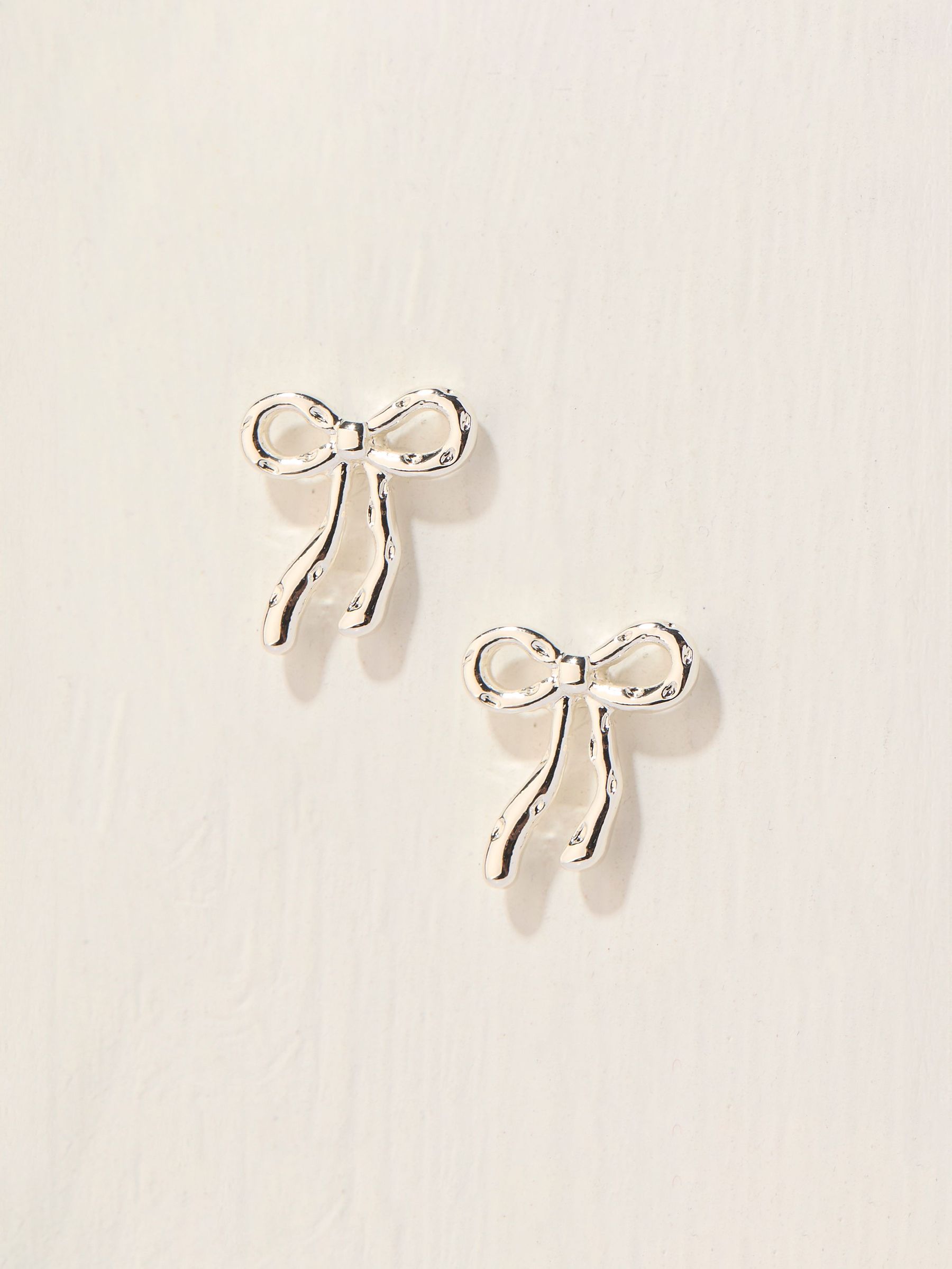 Silver Coloured Bow Stud Earrings (AT0446) | £10.50