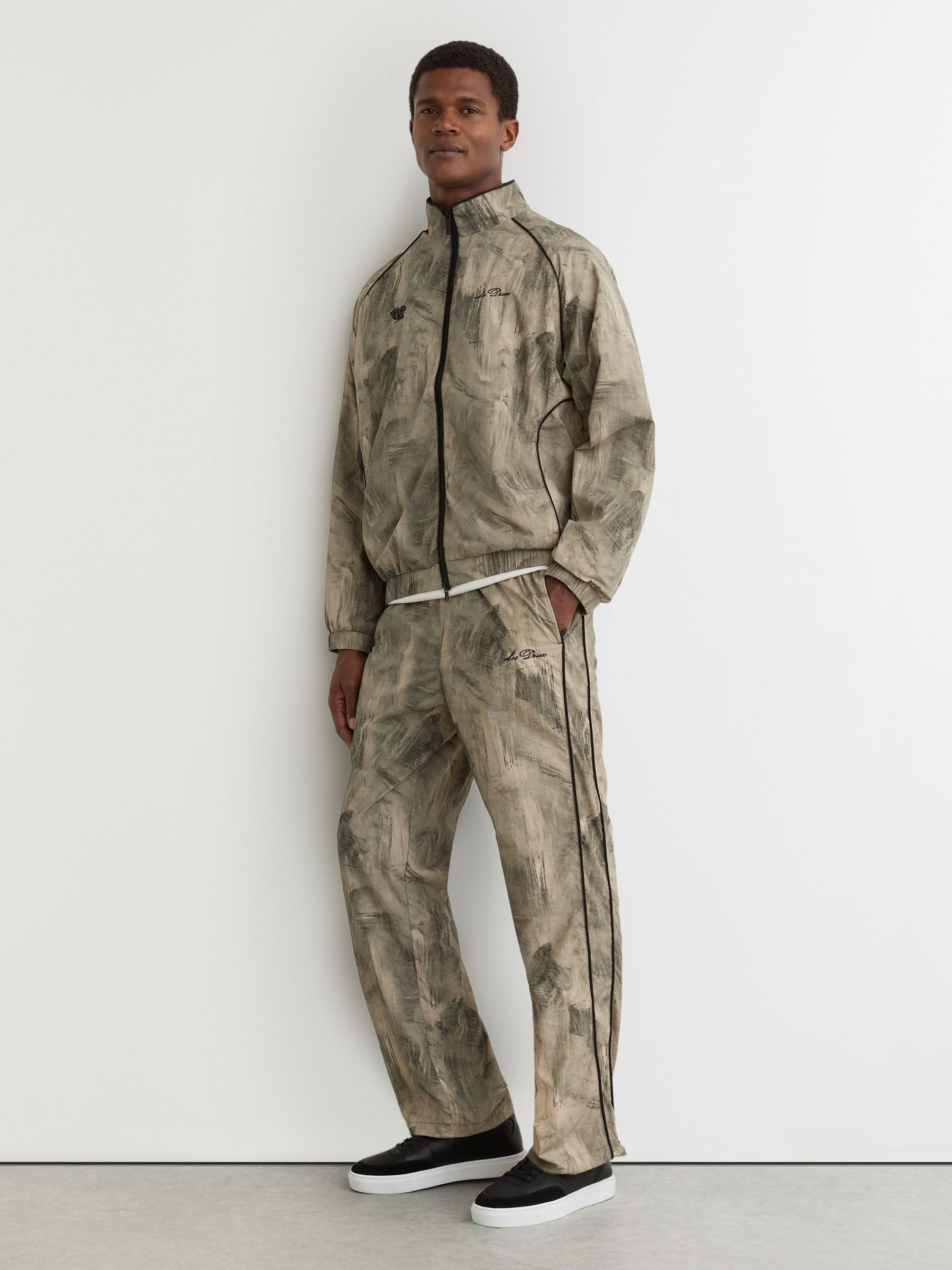 Abstract-Print Track Trousers in Dark Sand (G58195) | £125