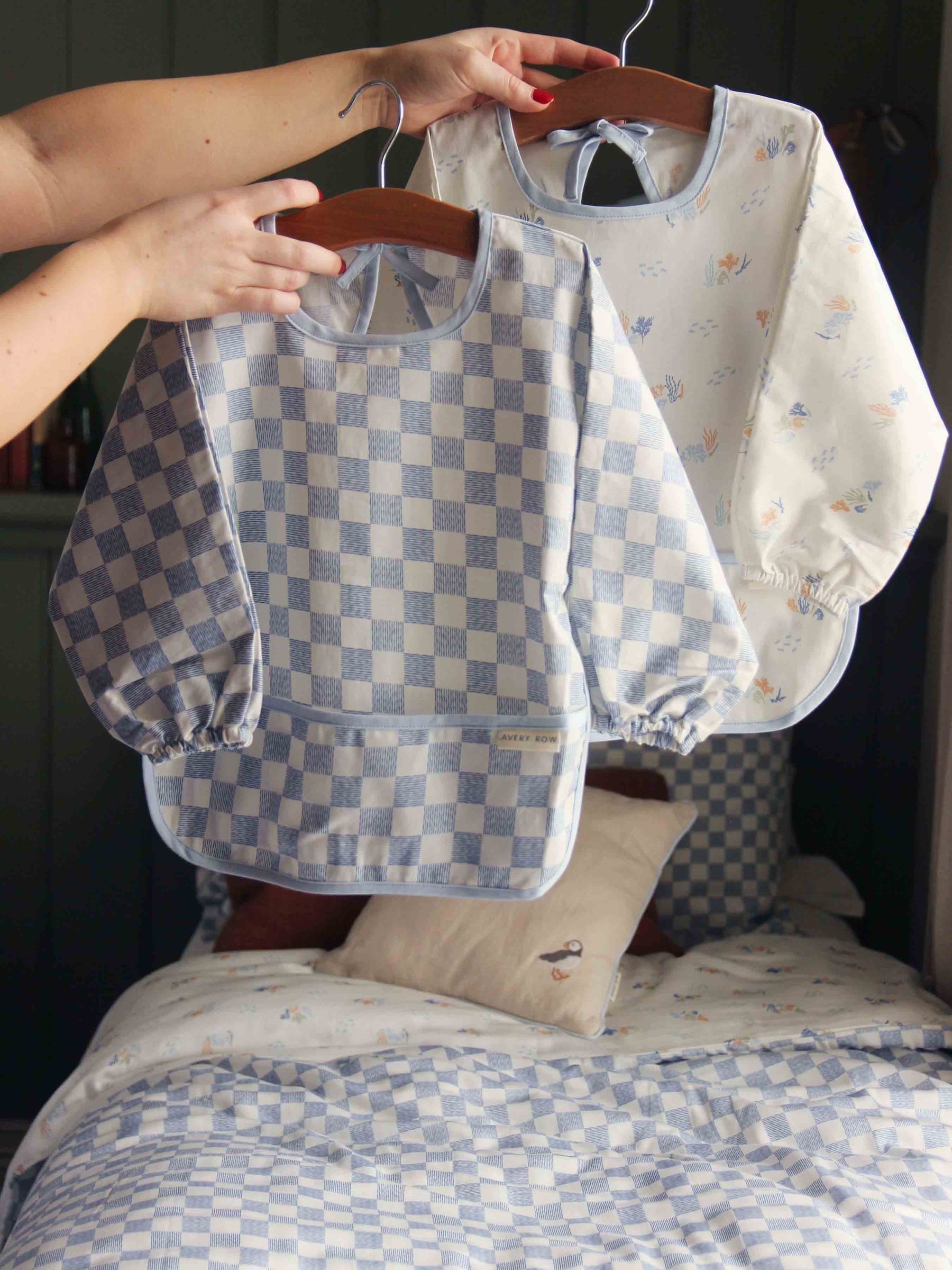 Waves Sleeved Bib (W41155) | £22