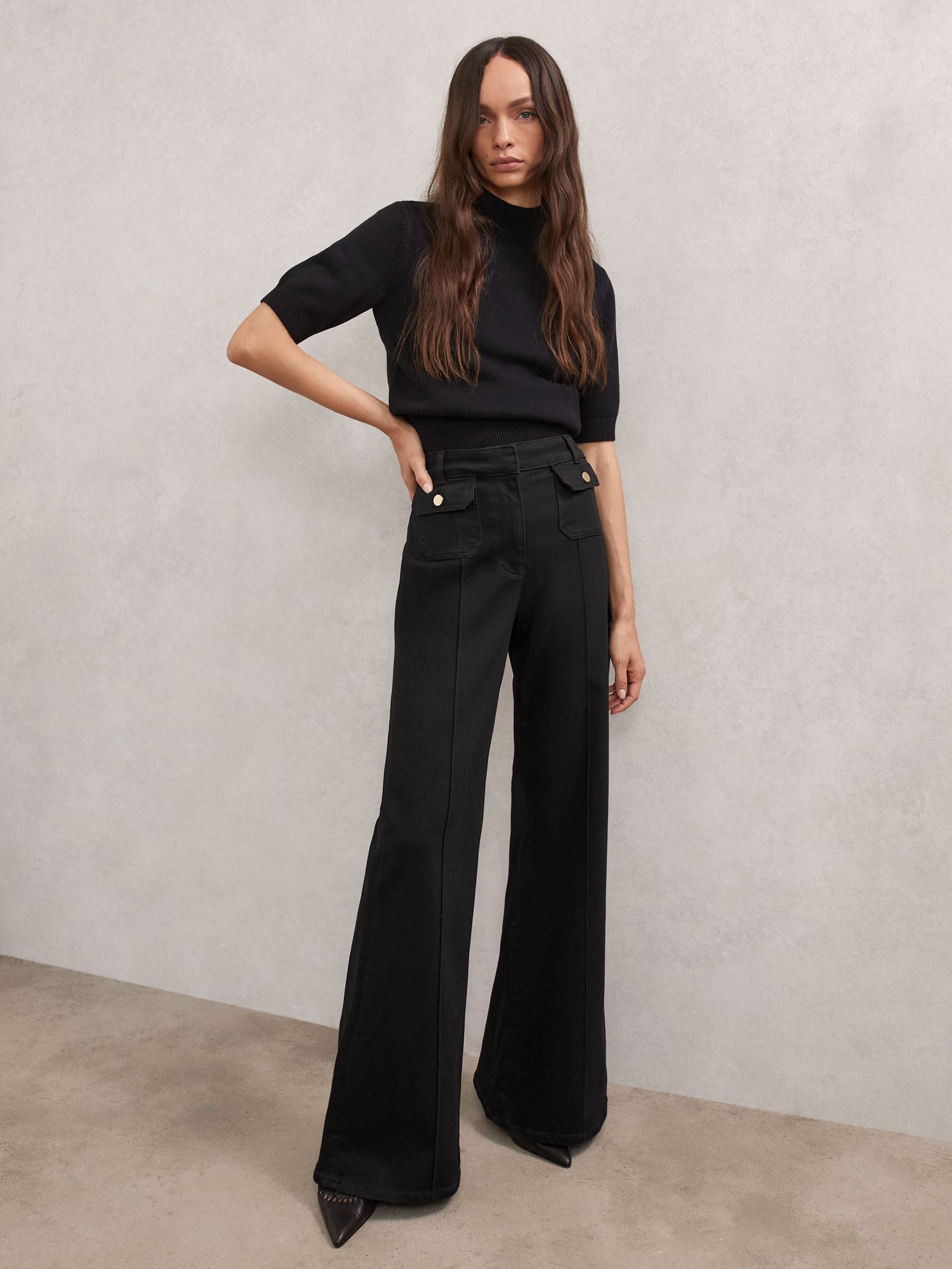 Flared Pocket-Detail Jeans in Black (Y04683) | £170