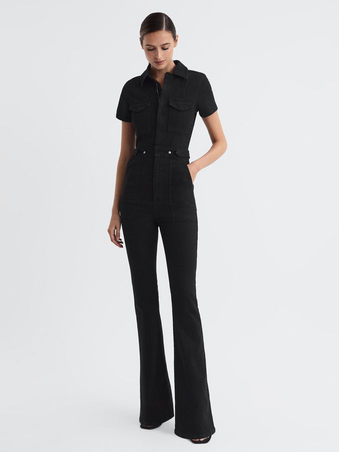 Good American Denim Bootcut Jumpsuit in Black (602032) | US$290
