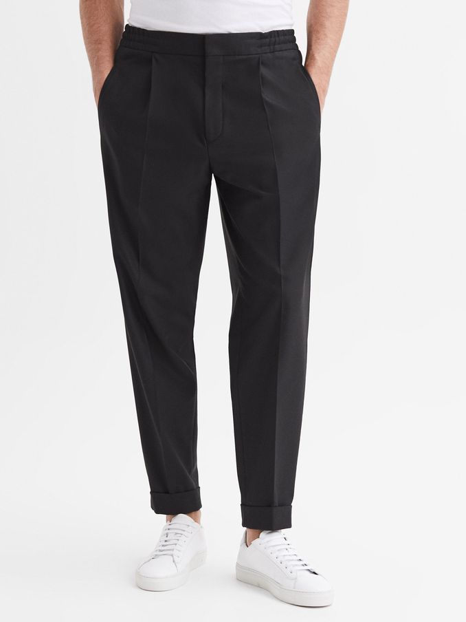 Relaxed Drawstring Trousers with Turn-Ups in Black (A11962) | US$143