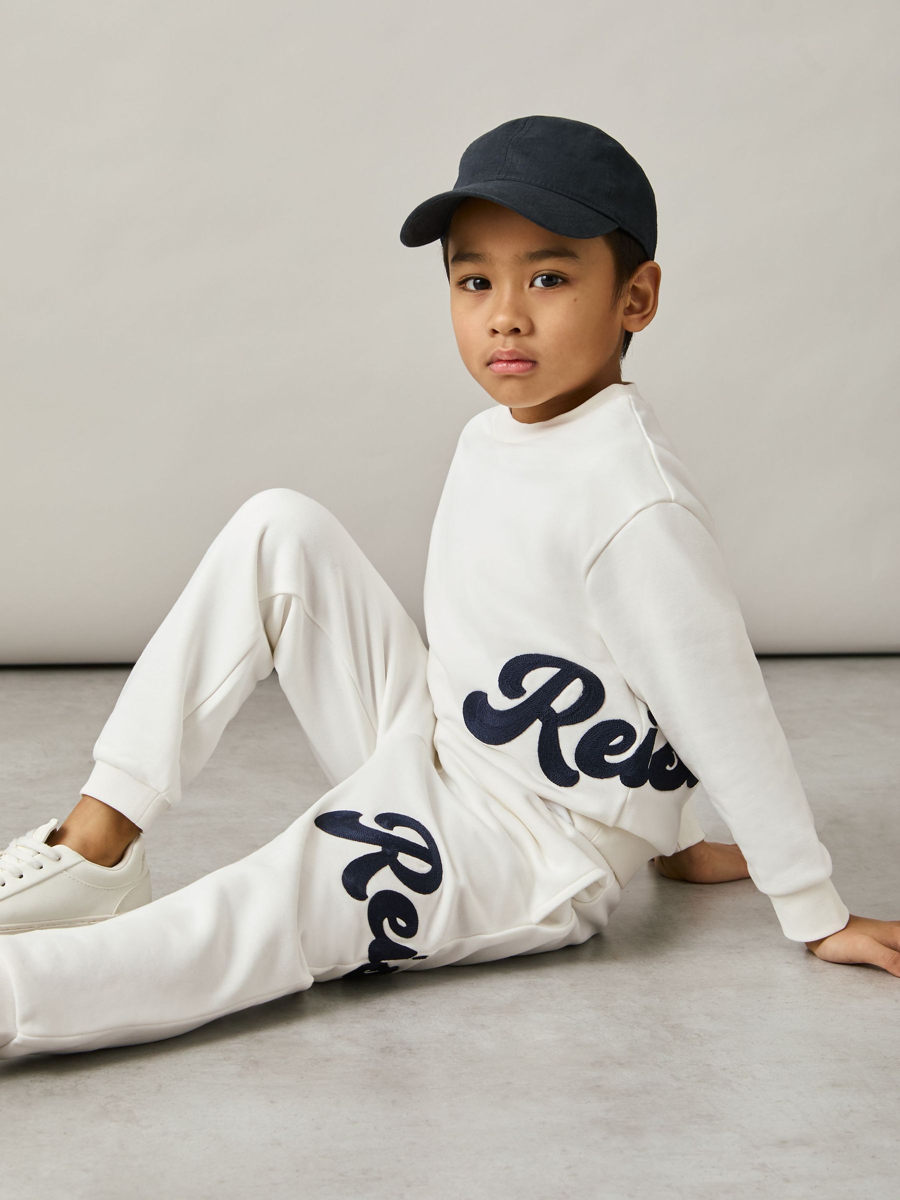 9-13 yrs Cotton-Blend Logo Script Joggers in White (AN4931) | 215 SAR