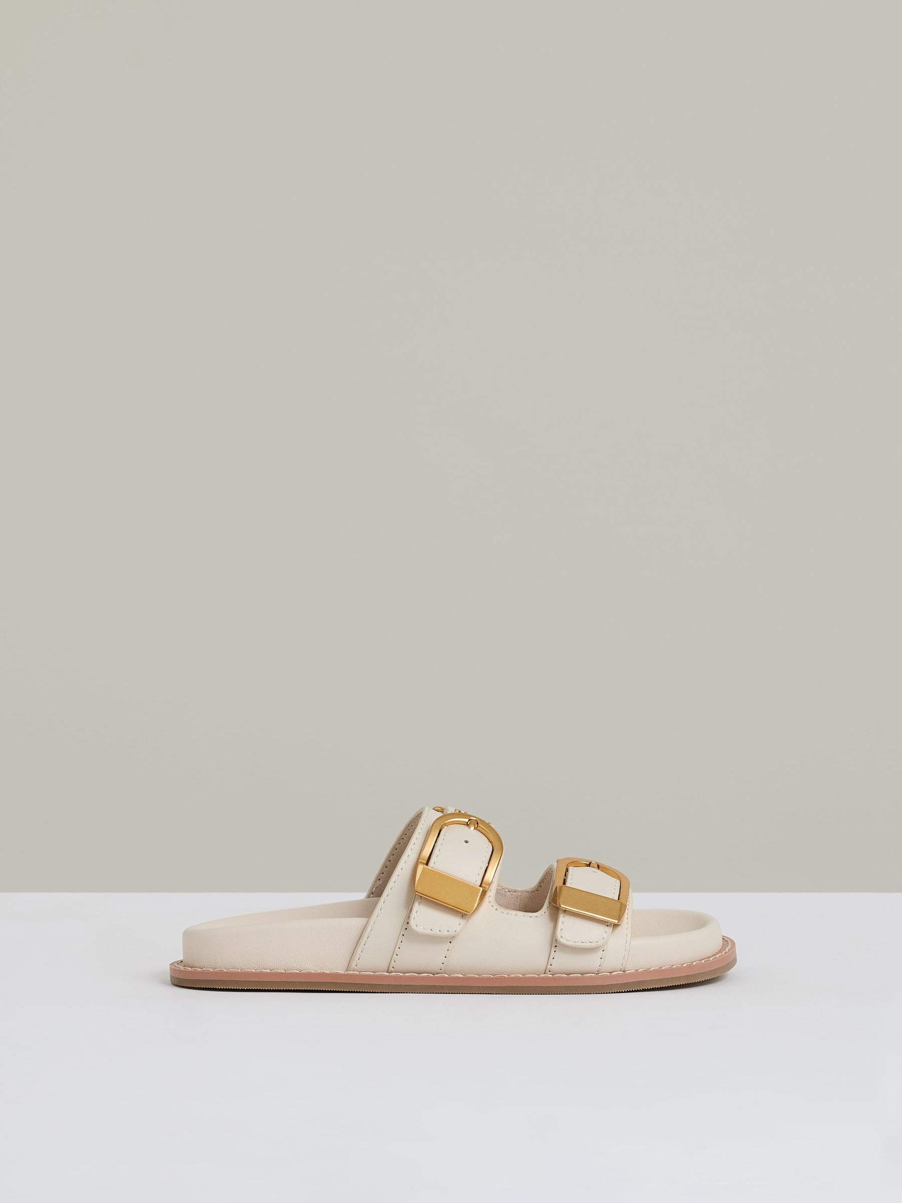 Leather Buckled Slip-On Sandals in Off White (AN6323) | US$285