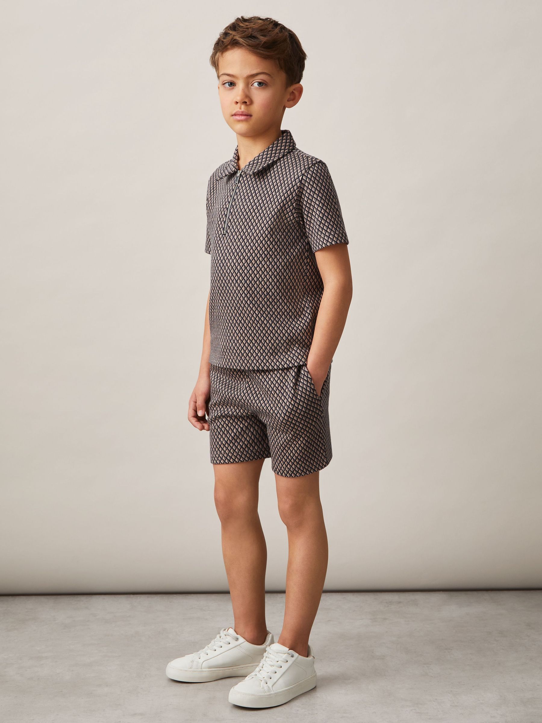 9-13 yrs Geometric Jacquard Polo Shirt in Tobacco Brown/Navy (AP0257) | €50