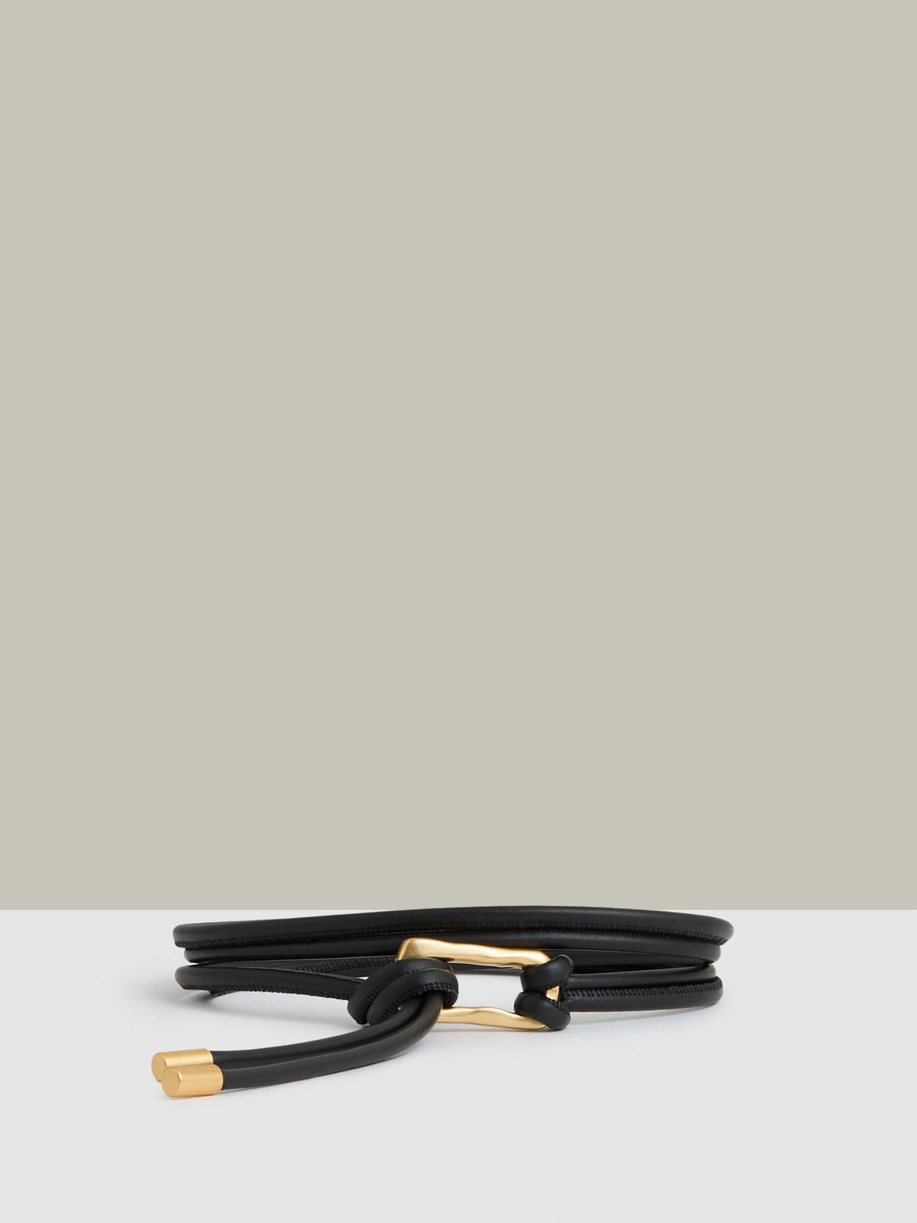 Sculpted Buckle Tubular Tie Belt in Black (AR6478) | US$95