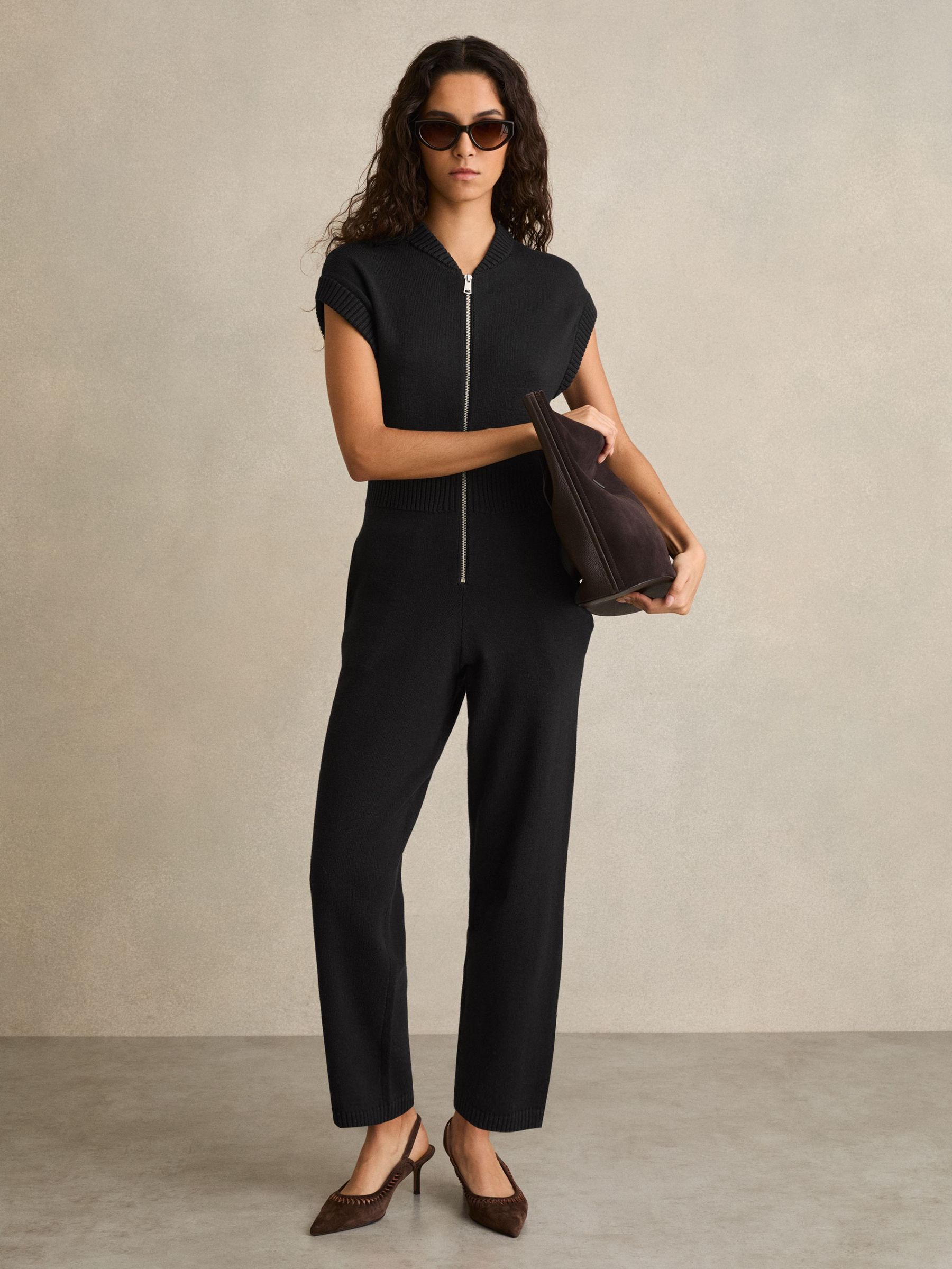Schwarzer Baumwollstrick-Jumpsuit mit Reißverschluss vorne (AW1185) | 195 €