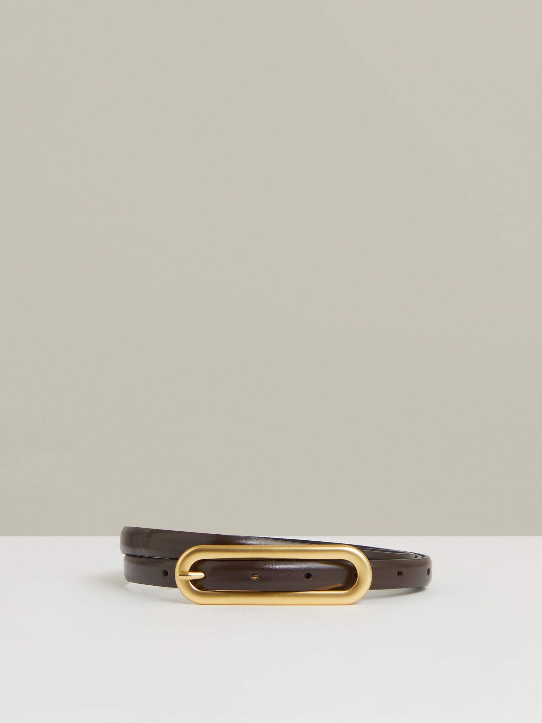 Thin Leather Elongated Buckle Belt in Chocolate (B60002) | US$75