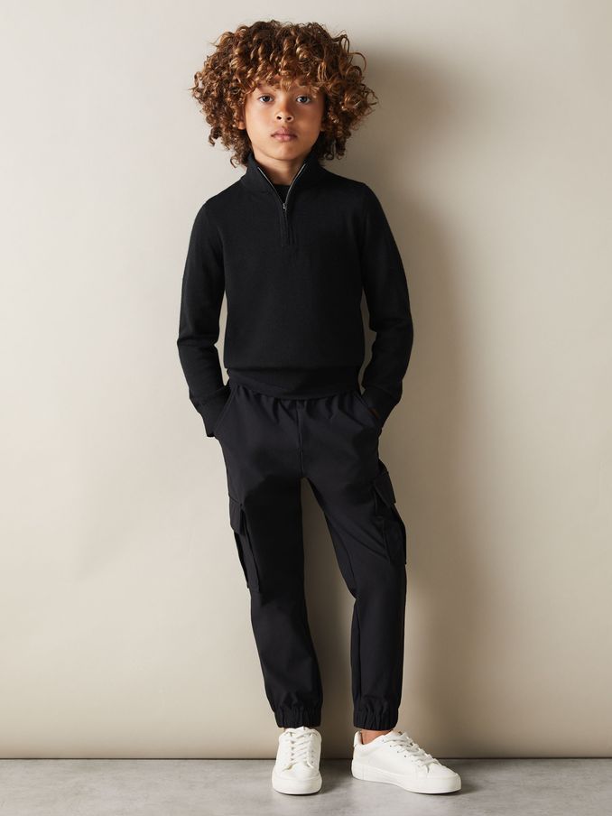 Pullover aus Merinowolle mit halbem Reißverschluss und Trichterkragen in Schwarz,3–9 J. (B61283) | 50 €