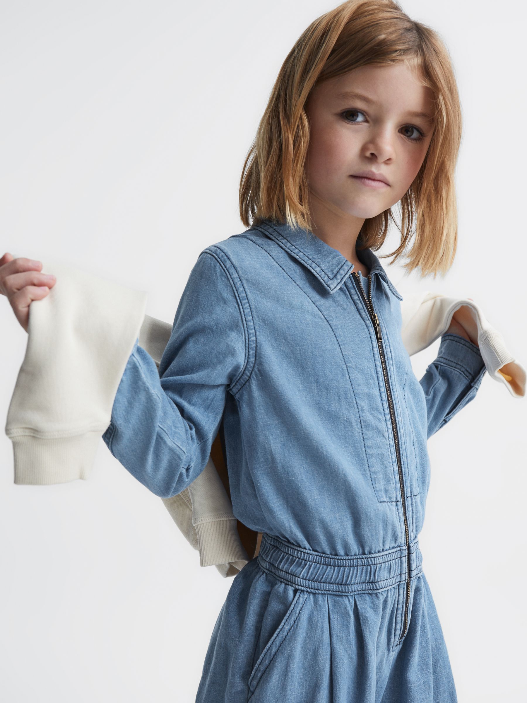 Denim Zip Front Jumpsuit in Mid Blue (D20948) | US$50