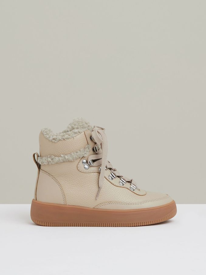 Grained Leather and Fleece Ankle Boots in Cream (E86299) | US$230