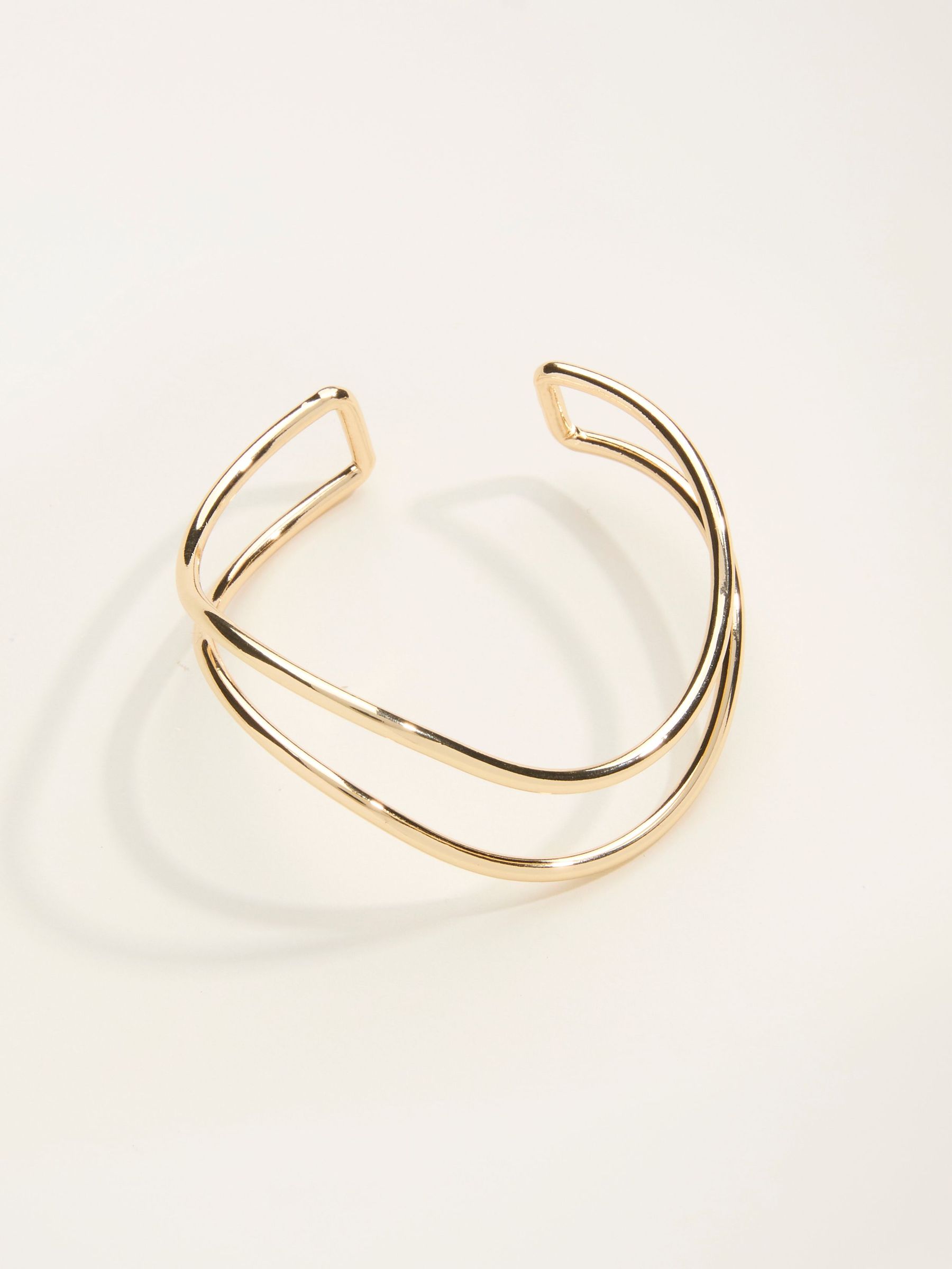 Gold Tone Twist Bangle (F21661) | €19