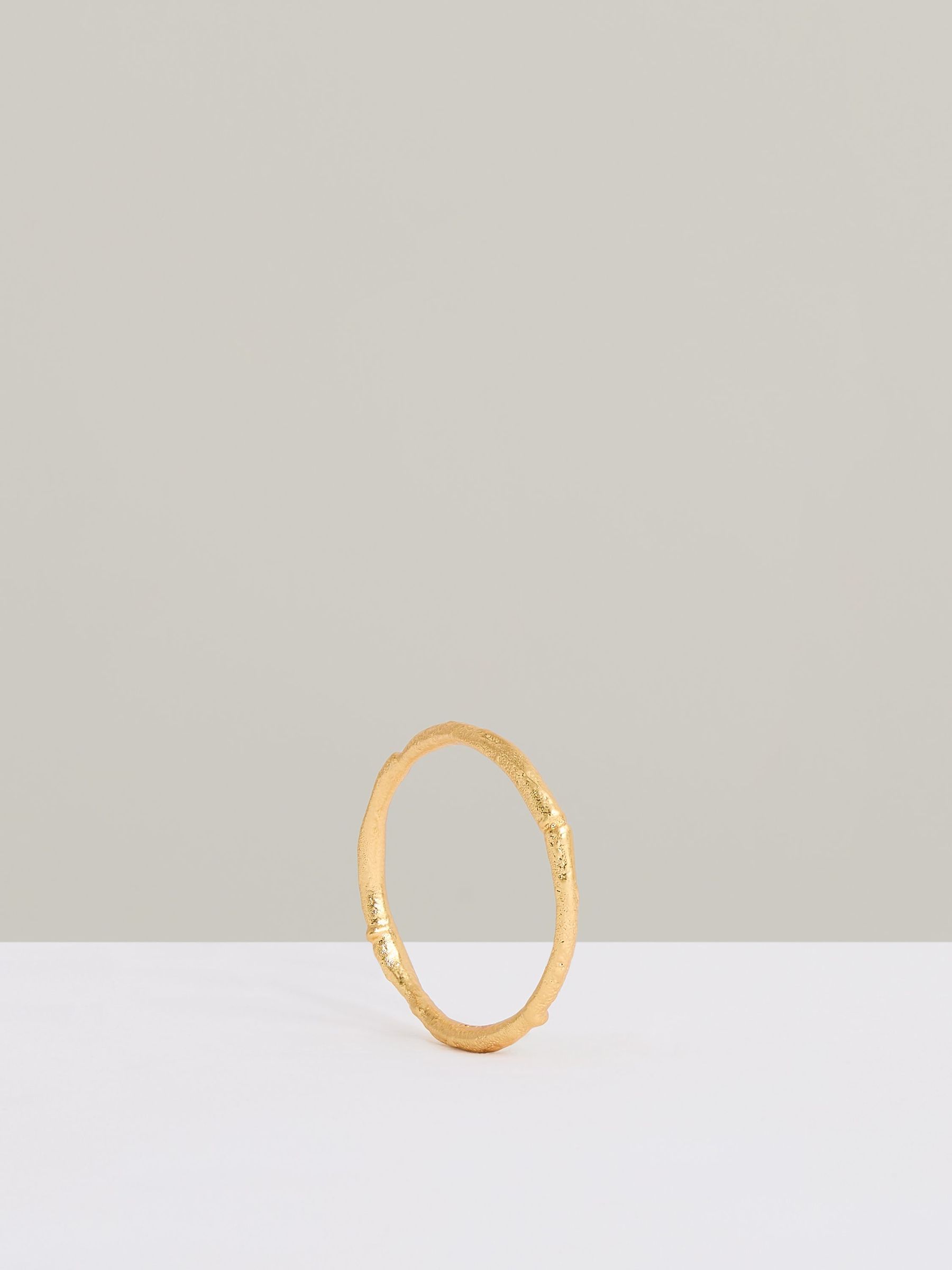 Molten Curve Bangle in Gold Tone (F27977) | €85