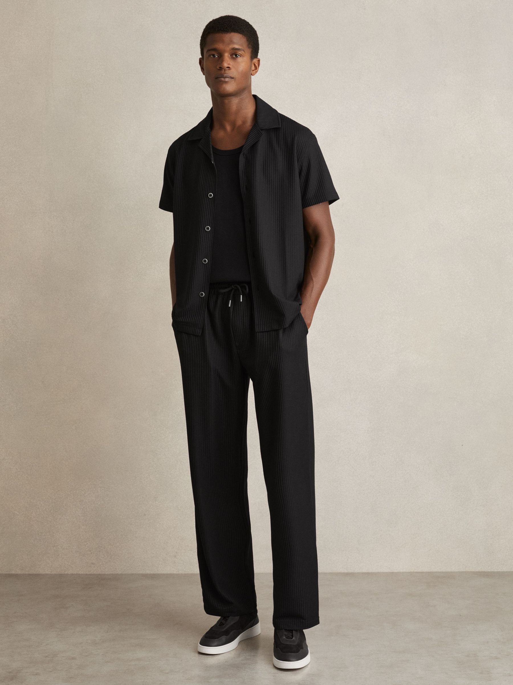 Textured-Knit Tapered Trousers in Black (F45273) | €140