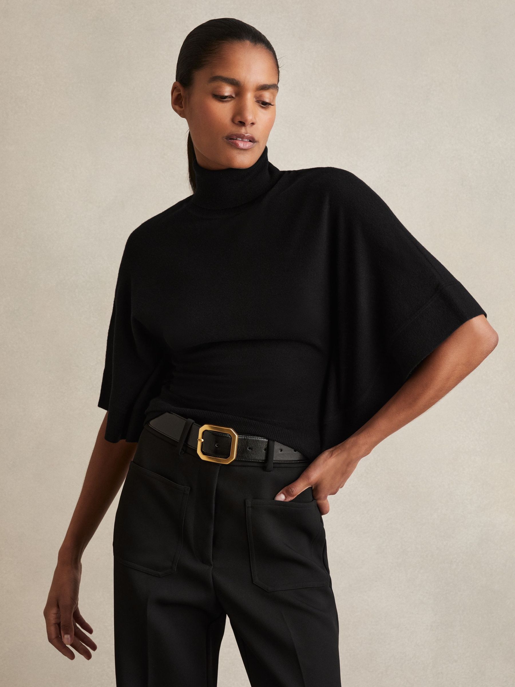 Merino Wool Batwing Roll-Neck Jumper in Black (F97689) | €125