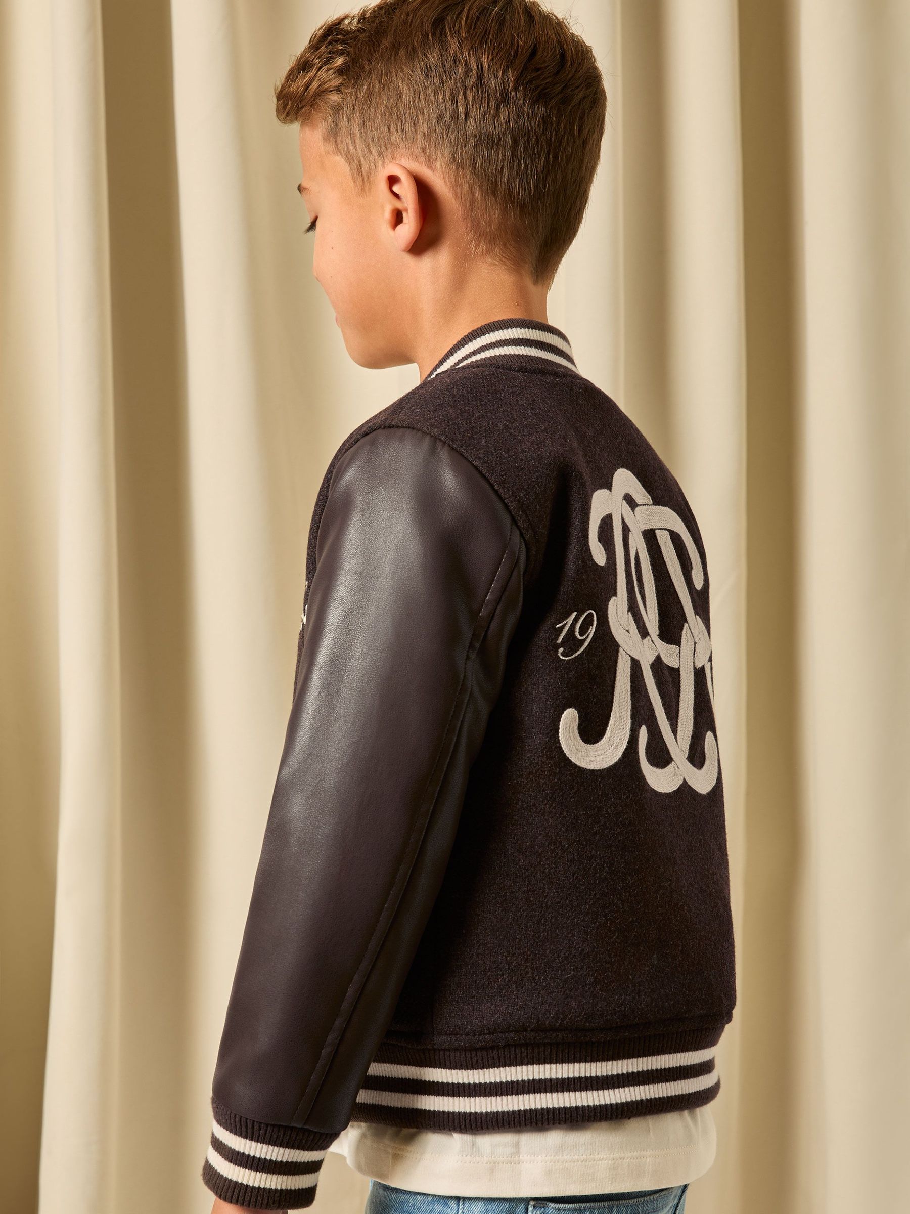 3-9 yrs Monogram Relaxed Varsity Jacket Unisex Fit in Brown/Off White (H71752) | $135