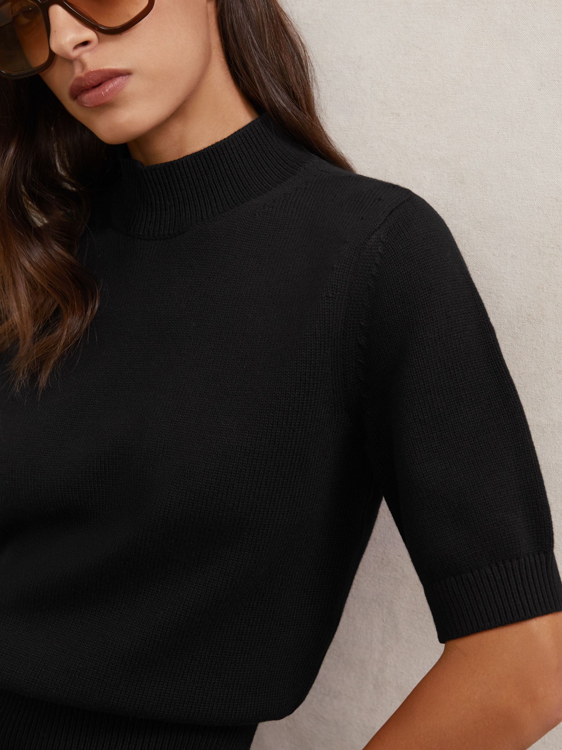 Cotton and Wool Funnel-Neck Knit Top in Black (H82424) | $155