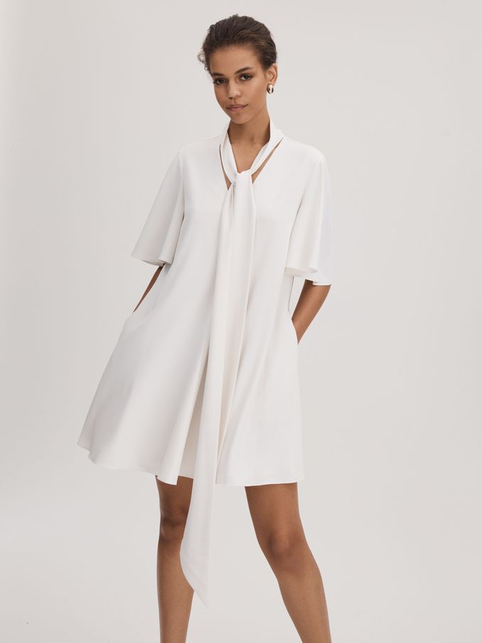 Florere Tie Neck Mini Dress in Ivory (Q85827) | US$95
