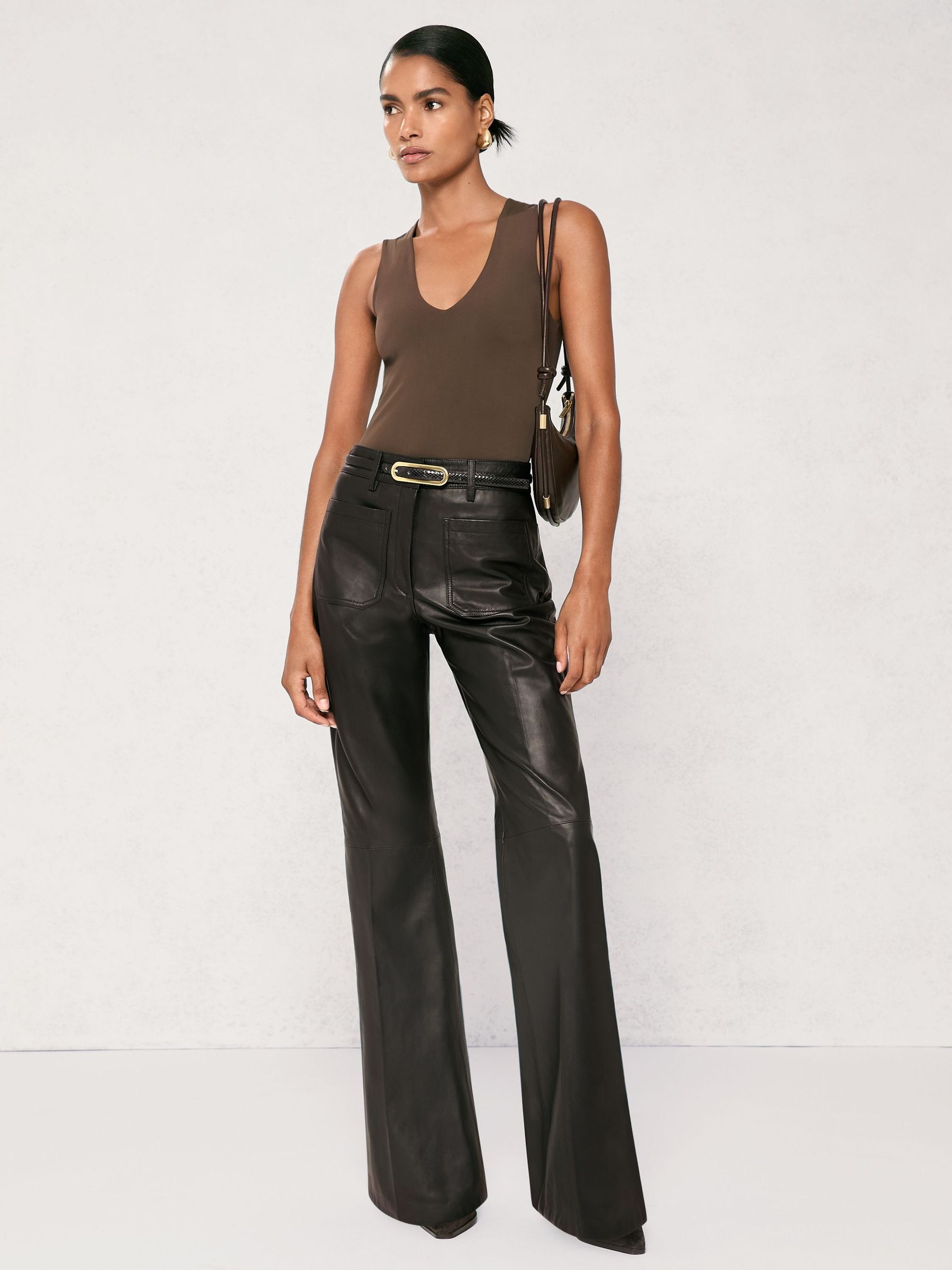 Leather High-Rise Flared Trousers in Black (W89203) | 2,340 QAR