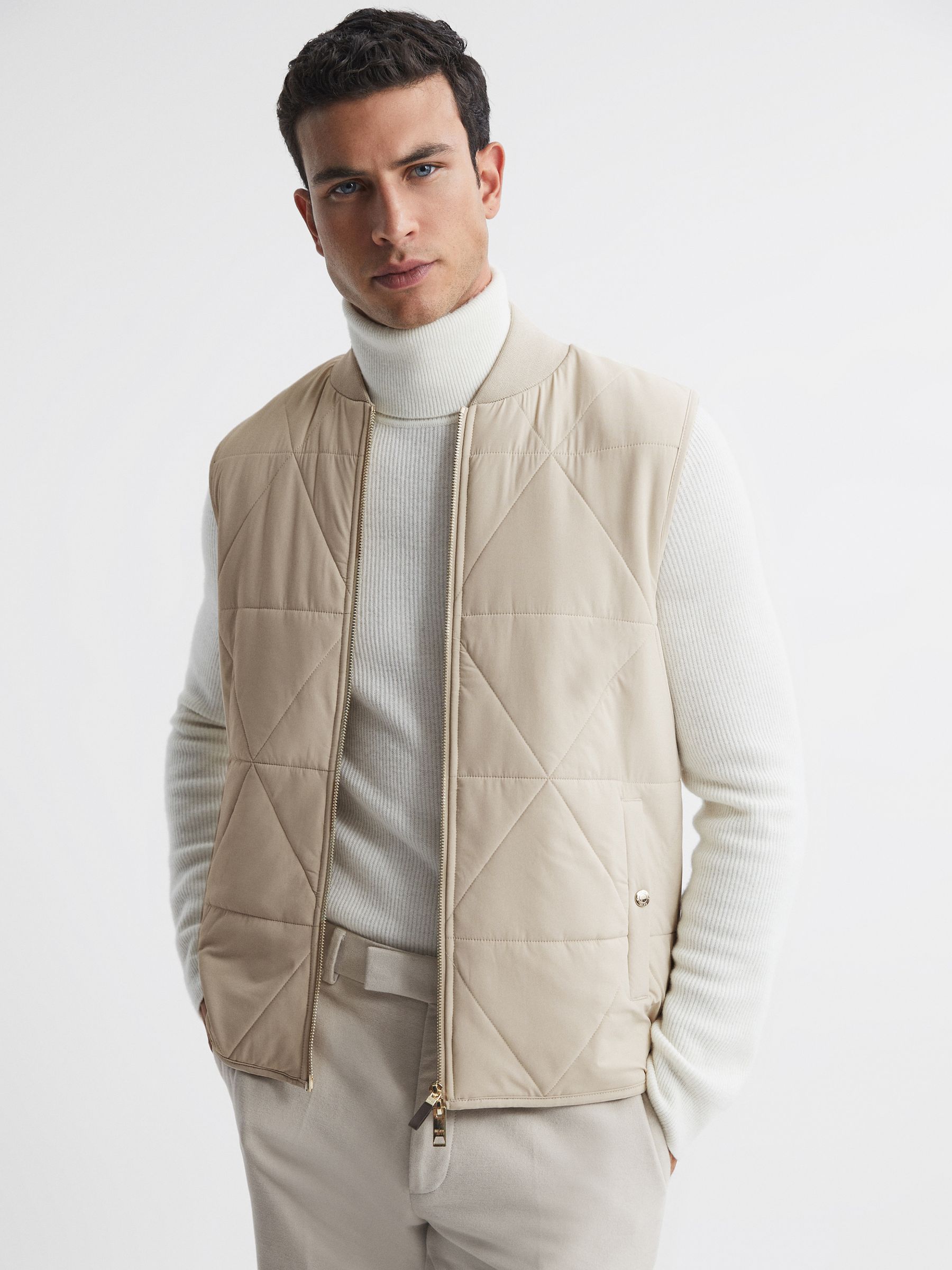 Hybrid Knitted-Quilted Sleeveless Jacket in Stone - Image 1 of 4 Hybrid Knitted-Quilted Sleeveless Jacket in Stone - Image 1 of 4