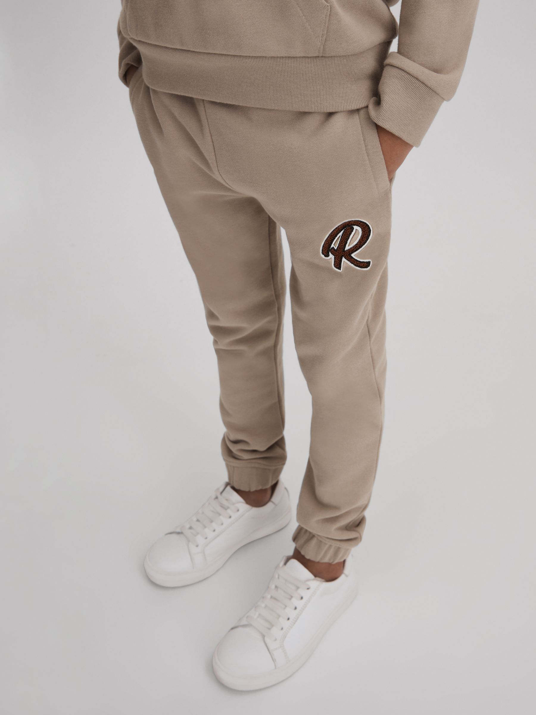 13-14 yrs Cotton Elasticated Waist Motif Joggers in Taupe - Image 3 of 4