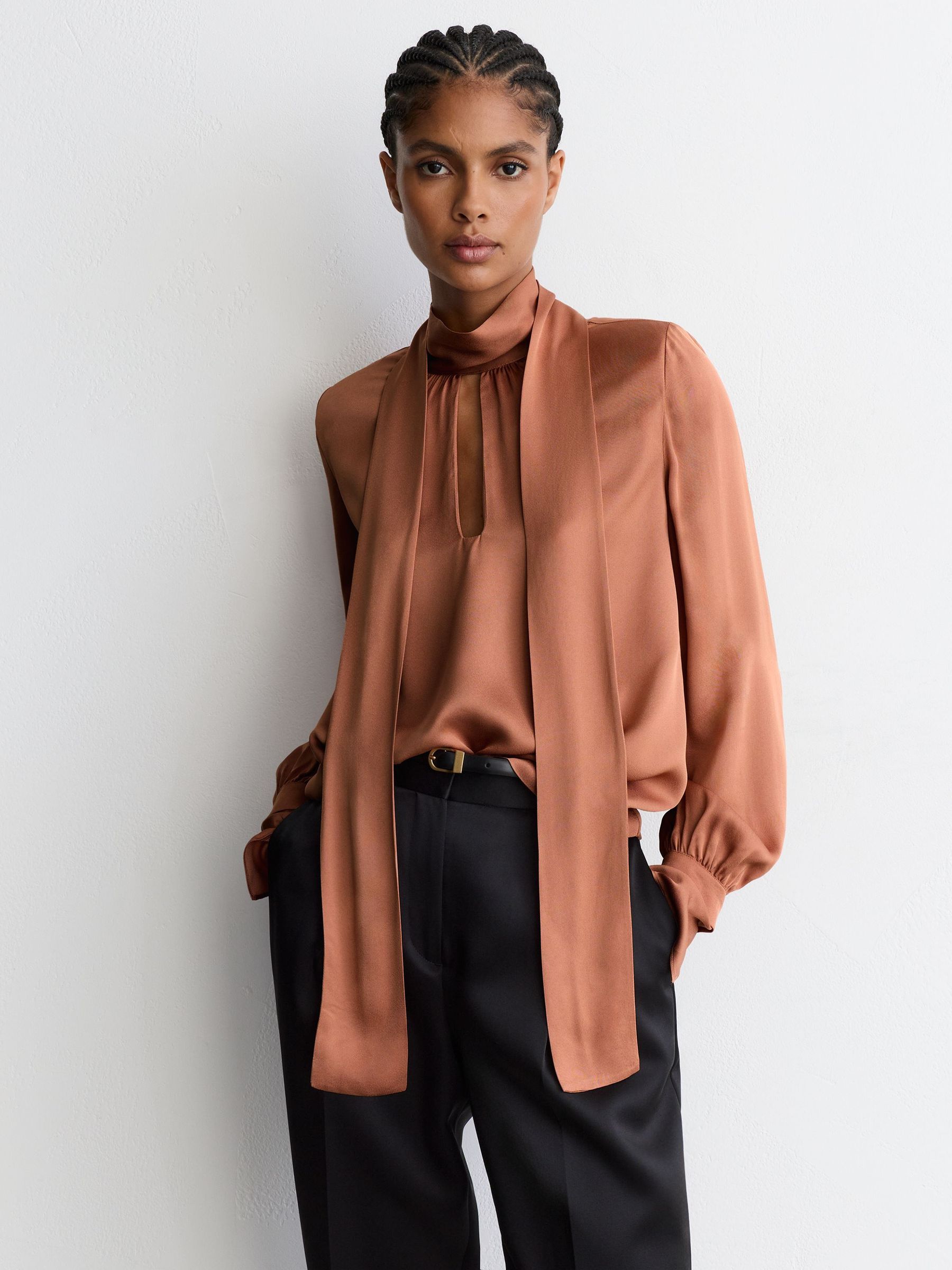High-Neck Tie-Back Keyhole Blouse in Peach Orange - Image 1 of 8 High-Neck Tie-Back Keyhole Blouse in Peach Orange - Image 1 of 8