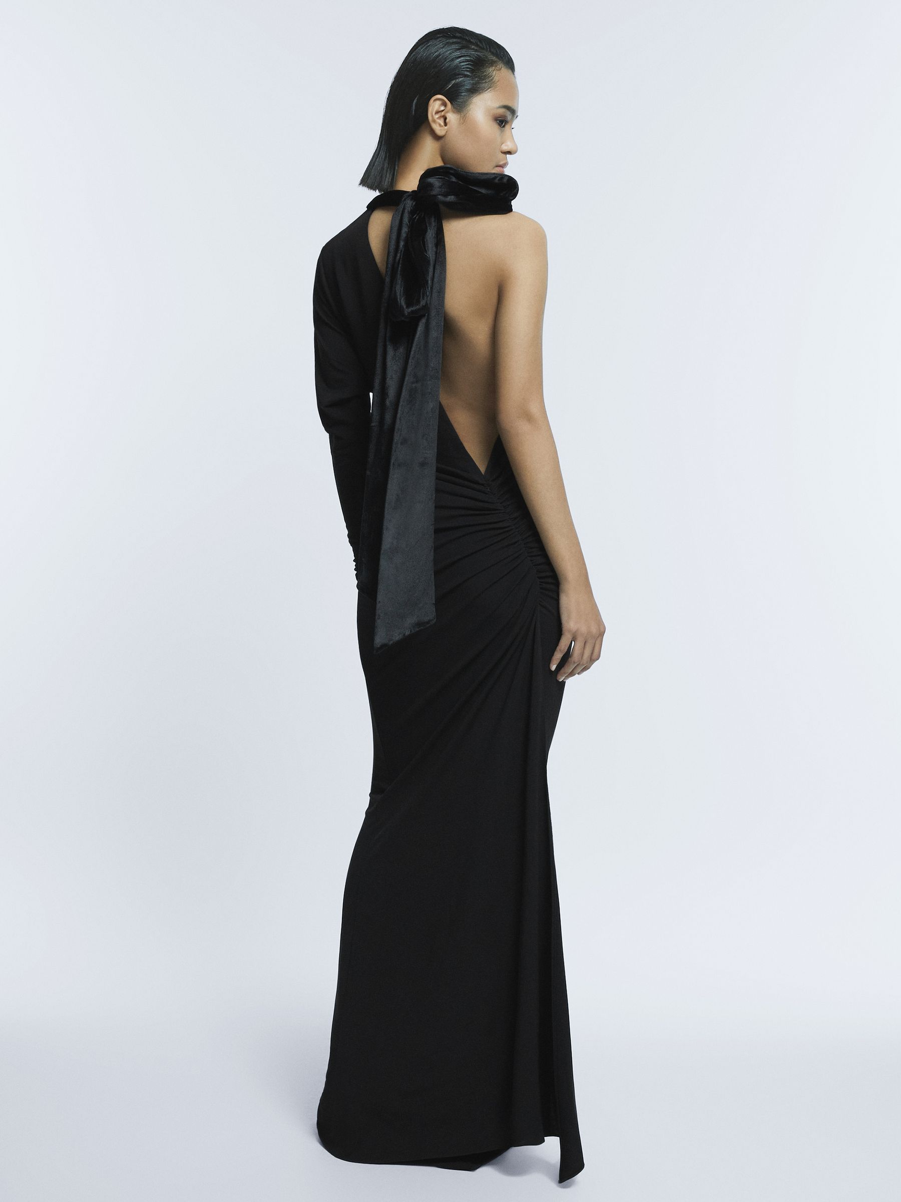 Fitted One-Shoulder Velvet Bow Maxi Dress in Black - Image 1 of 5