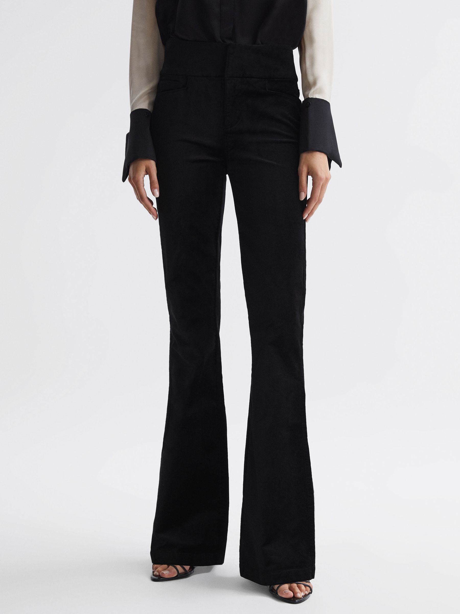 Paige Velvet Flared High Rise Jeans in Black - Image 1 of 5