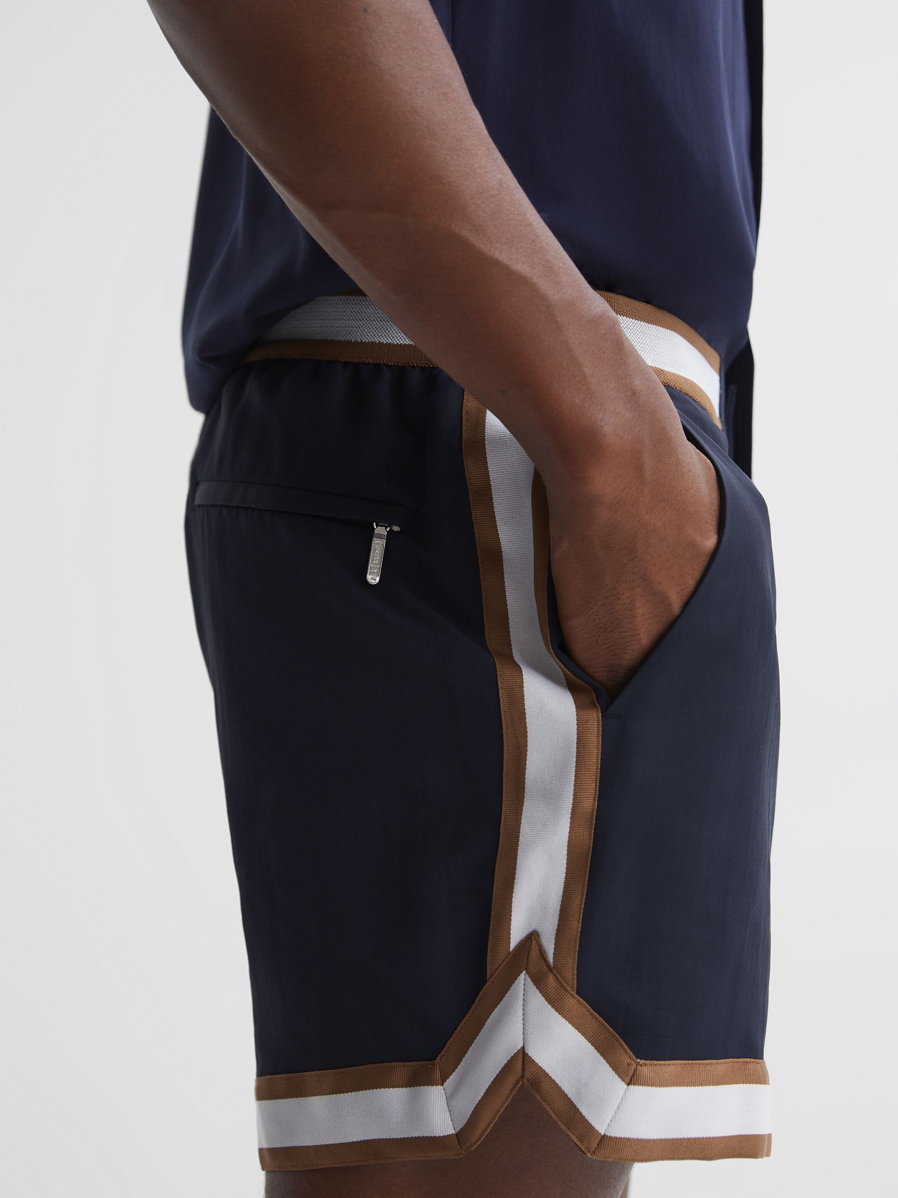 Reiss | Ché Elasticated Waist Contrast Swim Shorts in Navy/Tobacco - Image 5 of 6
