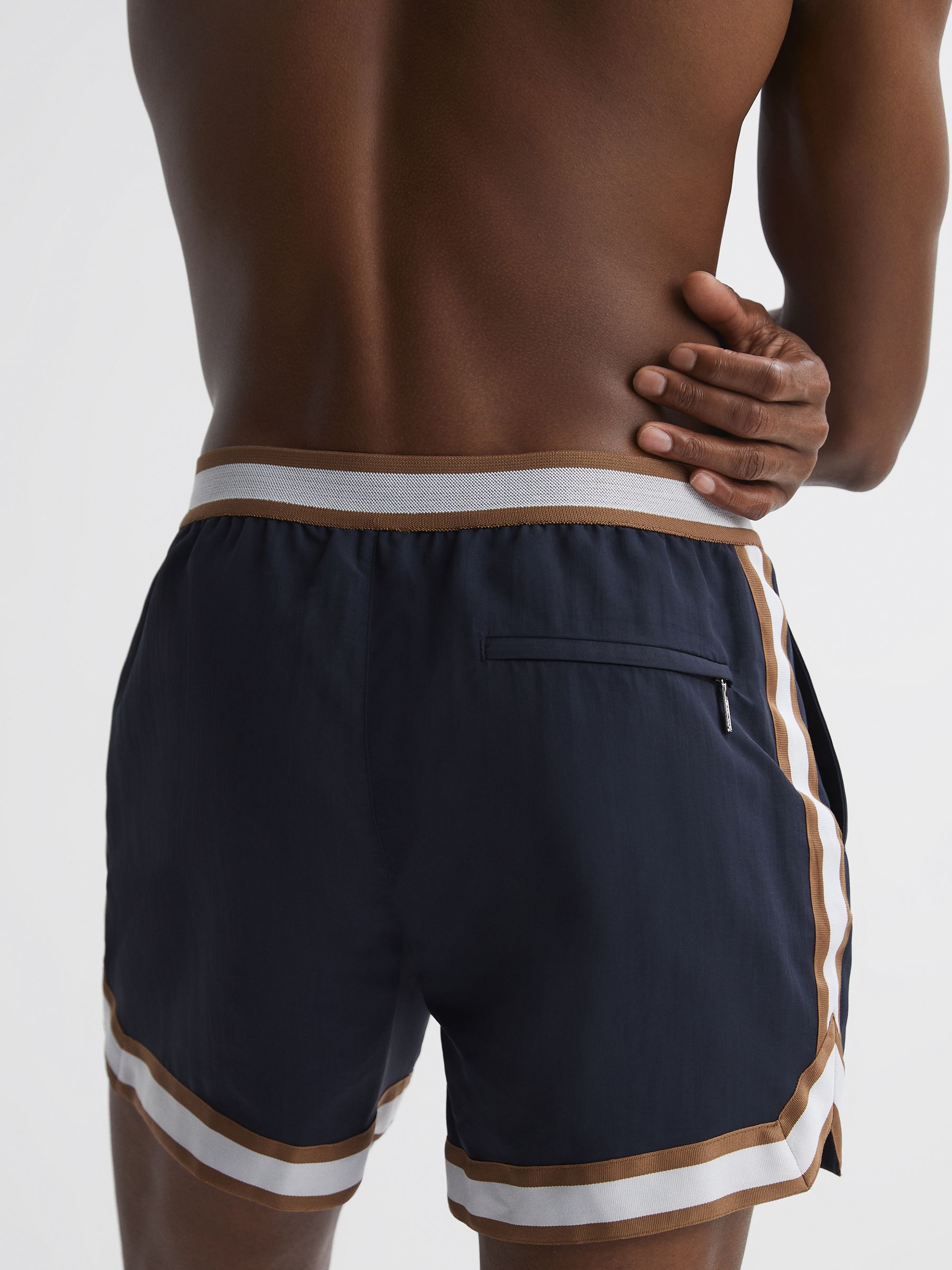 Reiss | Ché Elasticated Waist Contrast Swim Shorts in Navy/Tobacco - Image 6 of 6