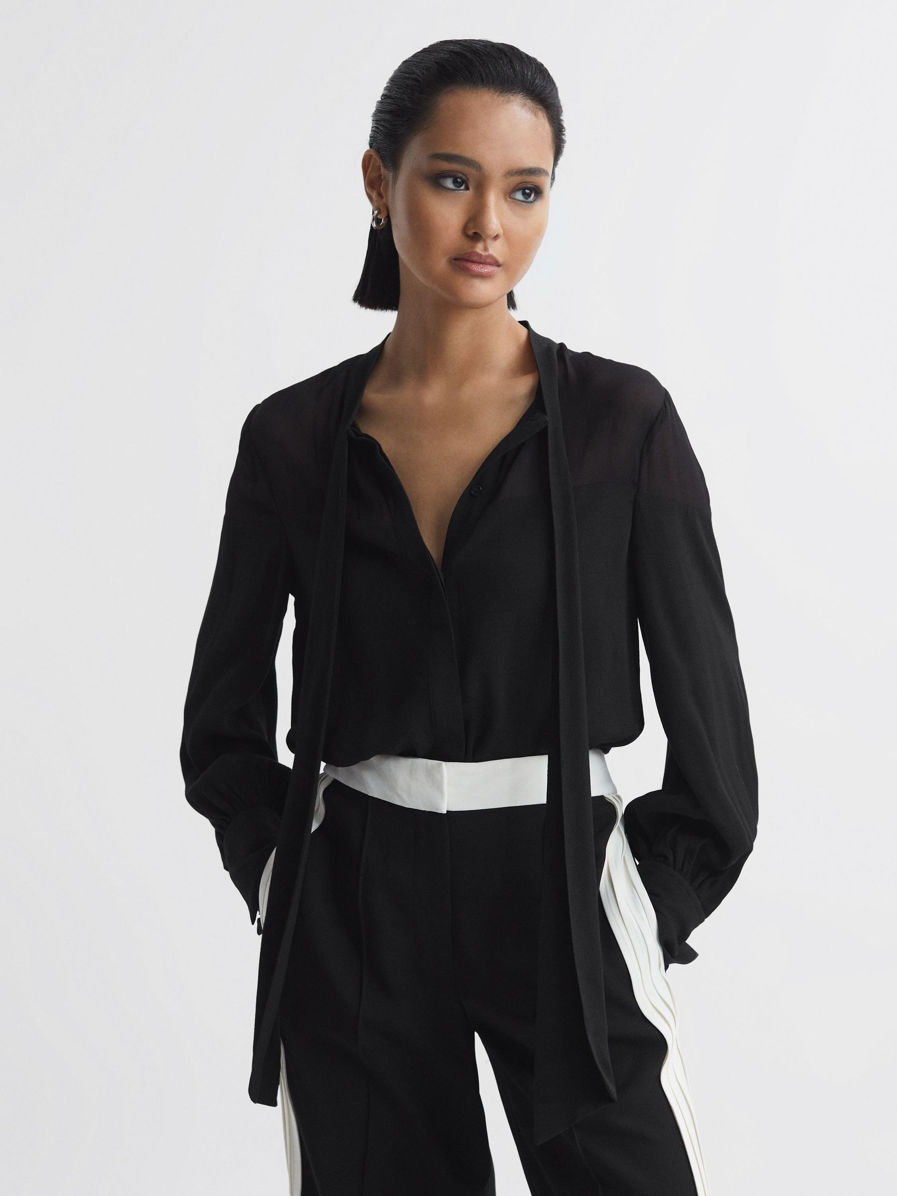 Tie Neck Semi-Sheer Blouse in Black - Image 1 of 5