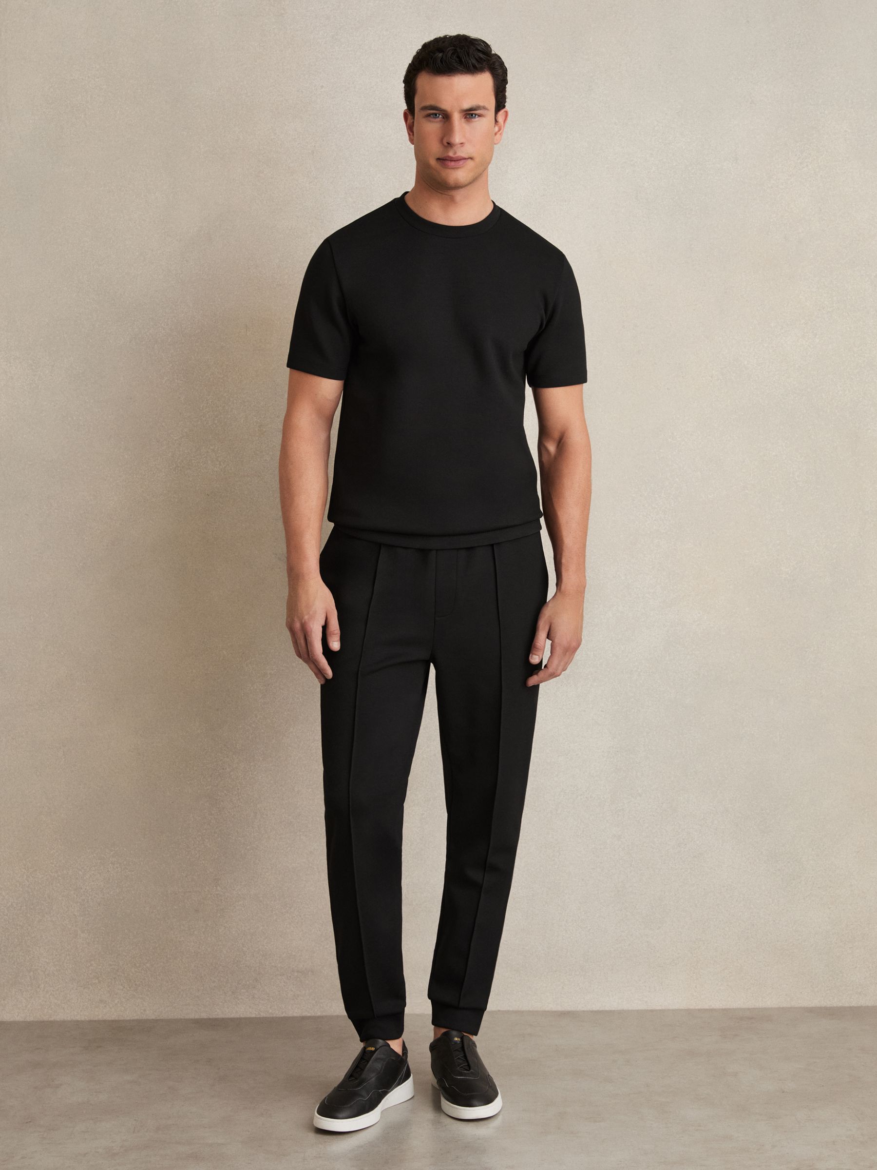 Interlock Jersey Drawstring Joggers in Black - Image 1 of 6