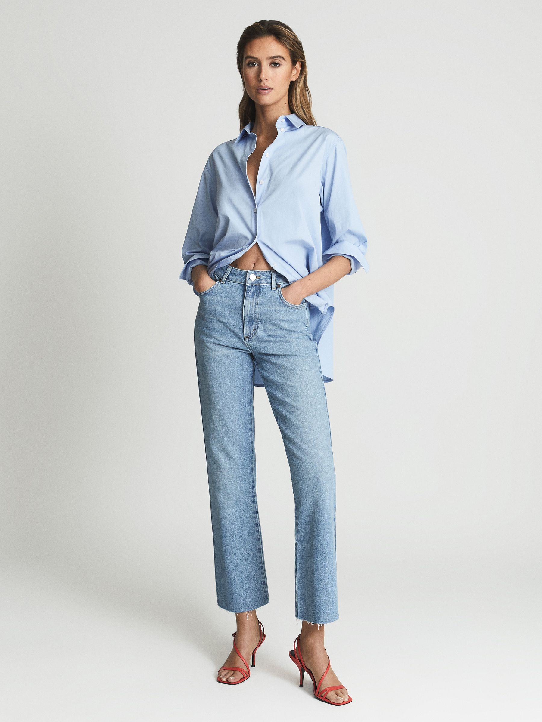 Mid Rise Kick Flared Jeans in Light Blue - Image 1 of 6