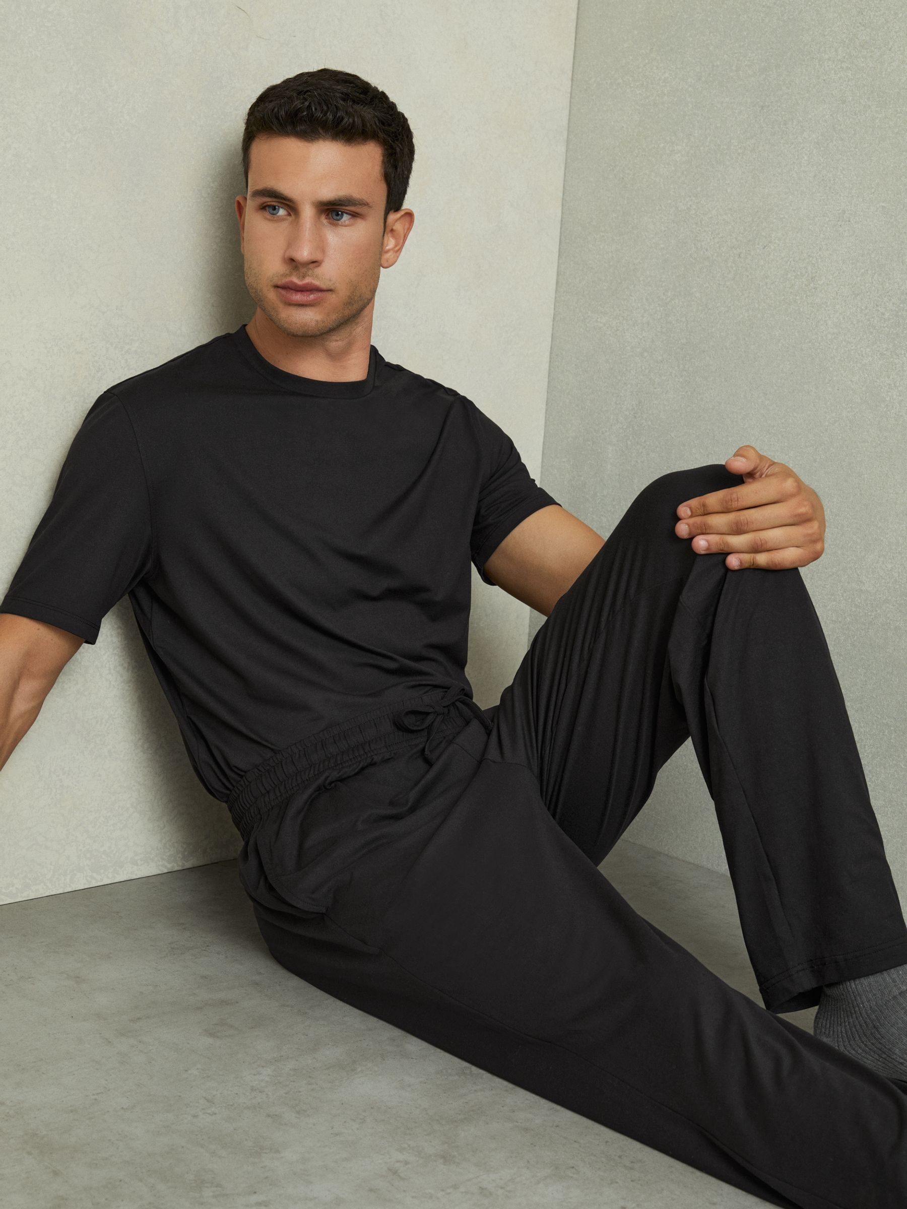 Tapered Stretch-Jersey Joggers in Black - Image 1 of 6