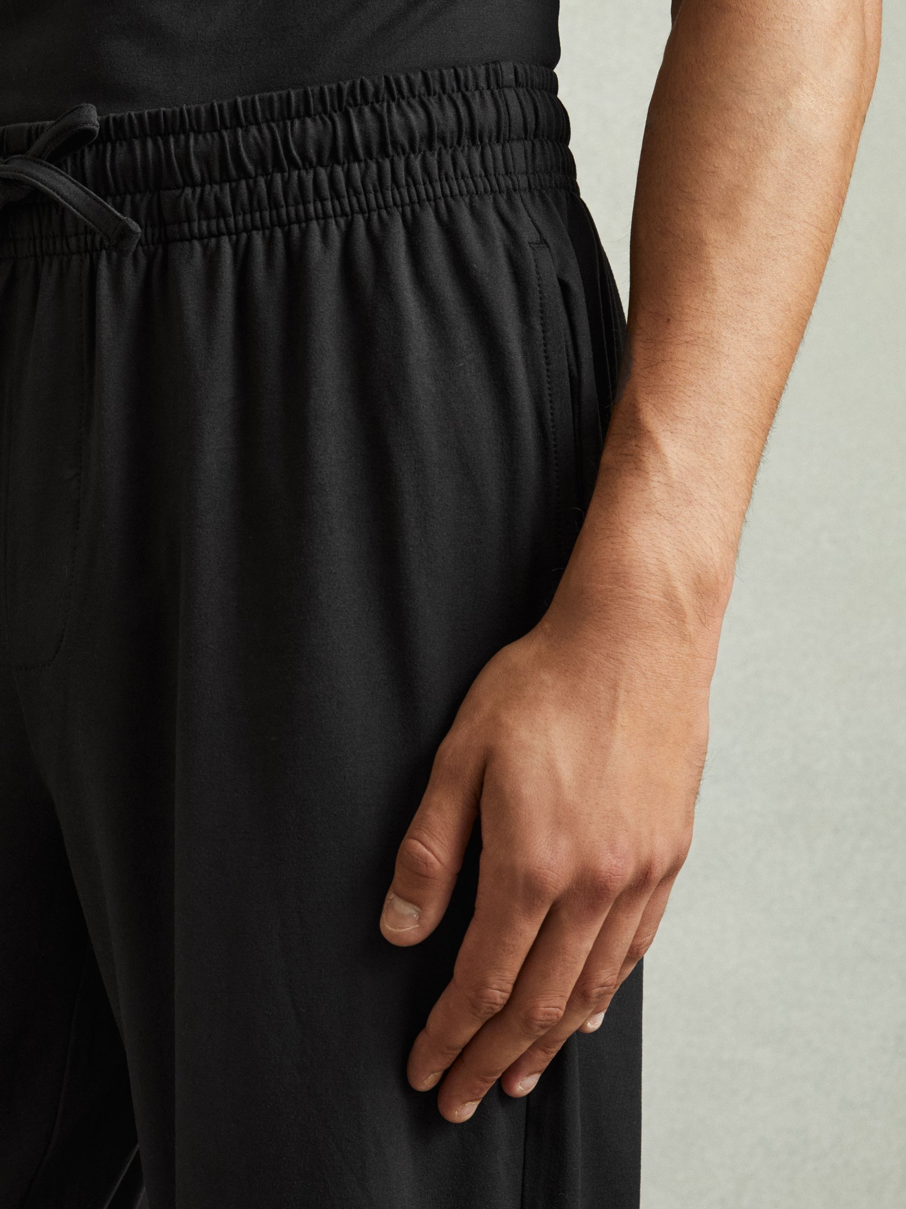 Tapered Stretch-Jersey Joggers in Black - image 4