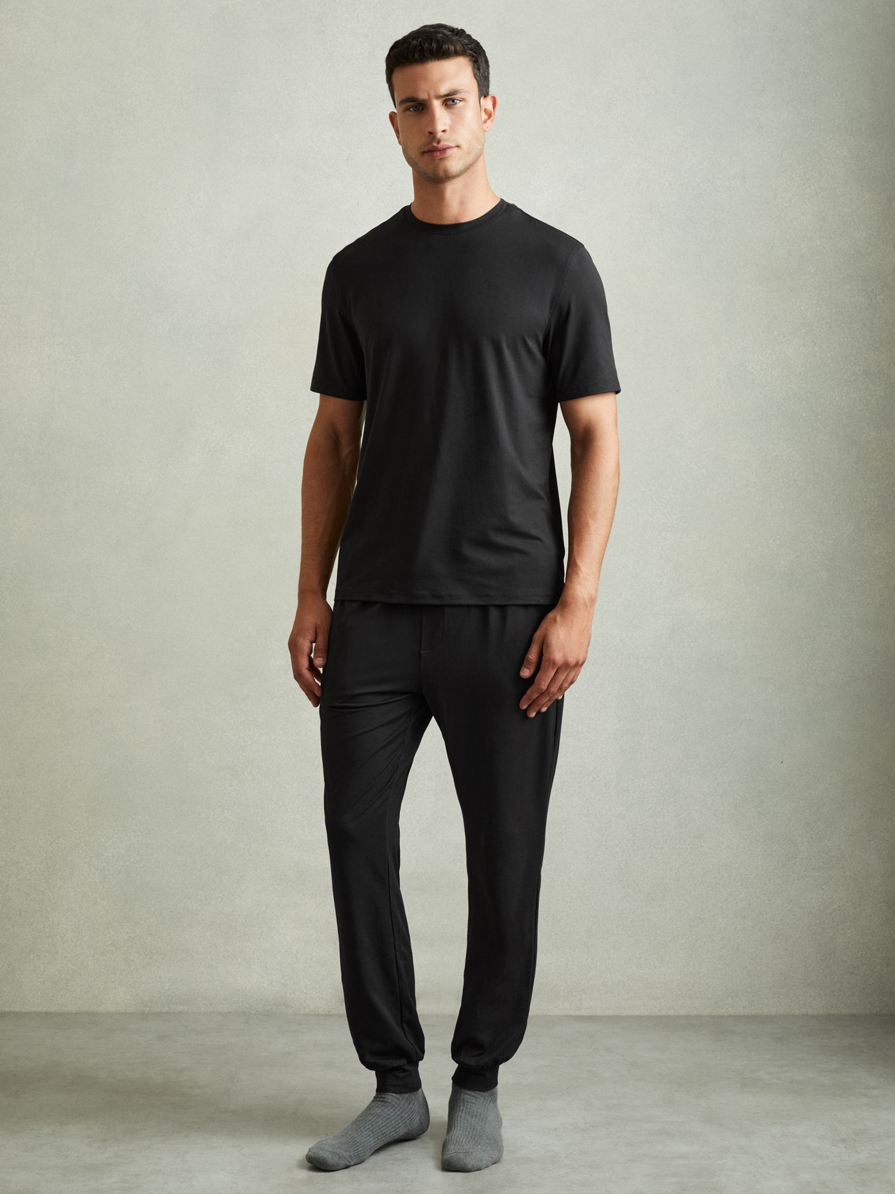 Tapered Stretch-Jersey Joggers in Black - Image 1 of 6