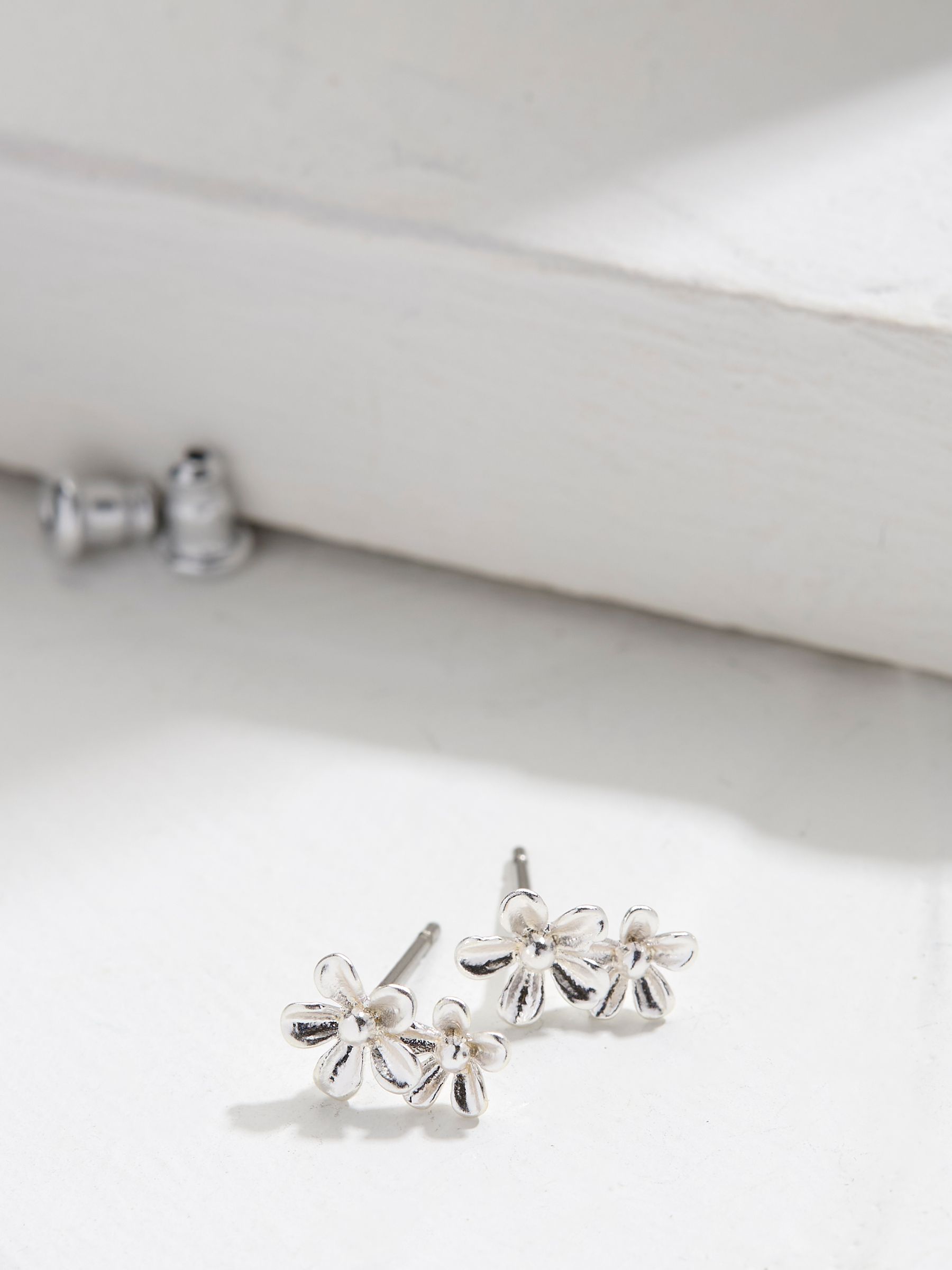 Silver Tone Double Flower Stud Earrings - Image 1 of 2