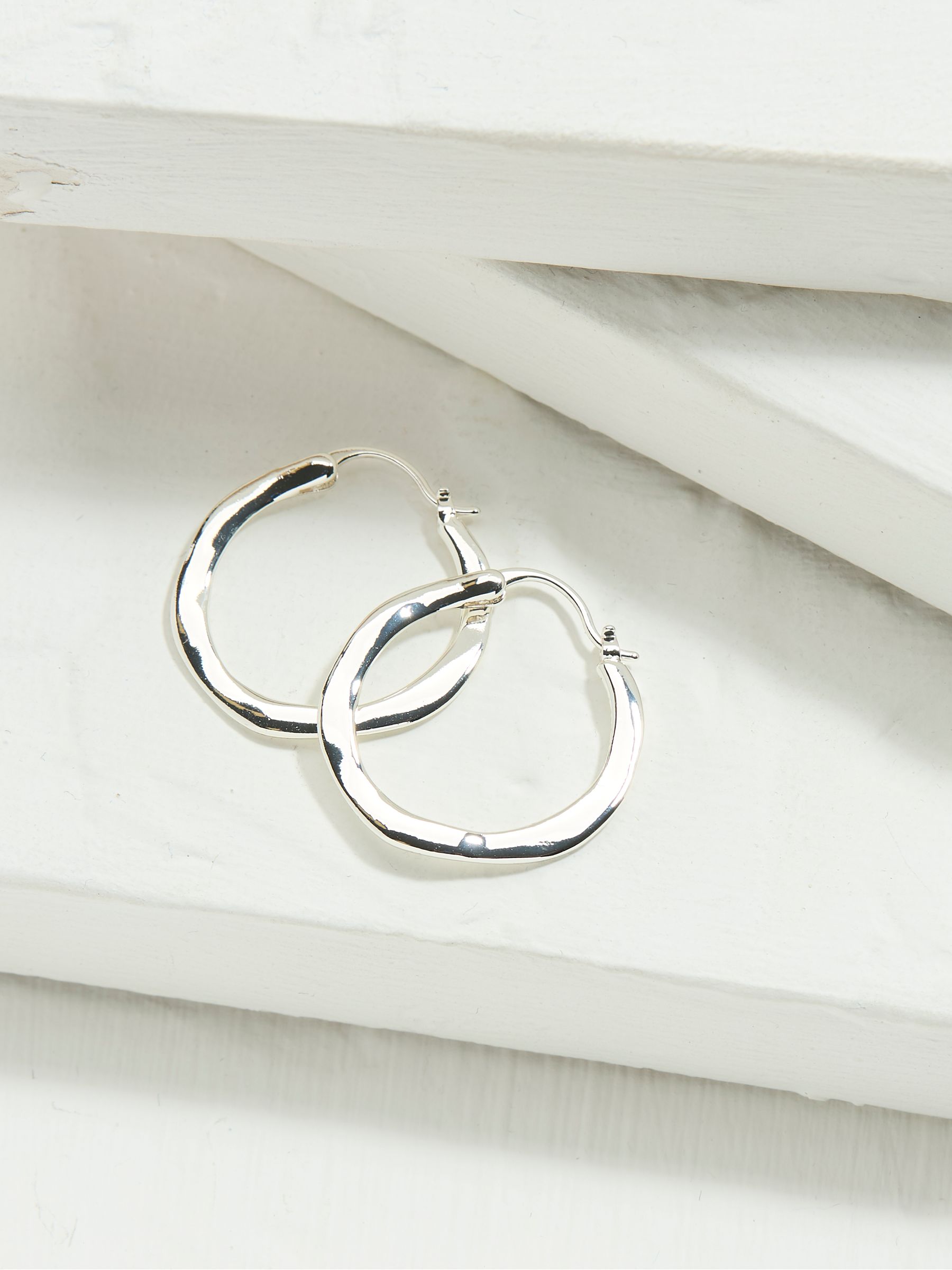Silver Tone Hammered Hoop Earrings - Image 1 of 2