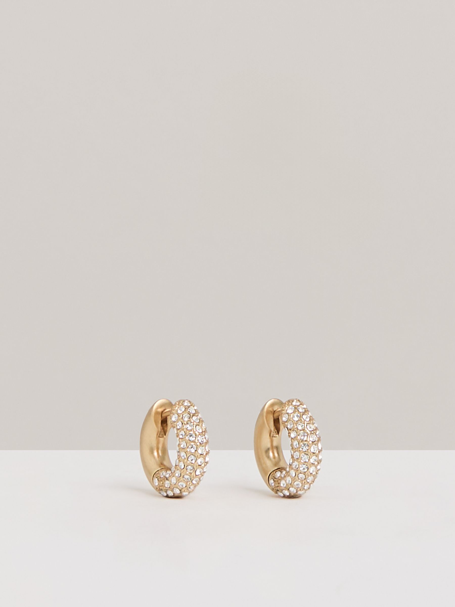 Pavé Huggie Earrings in Gold Tone - Image 1 of 6