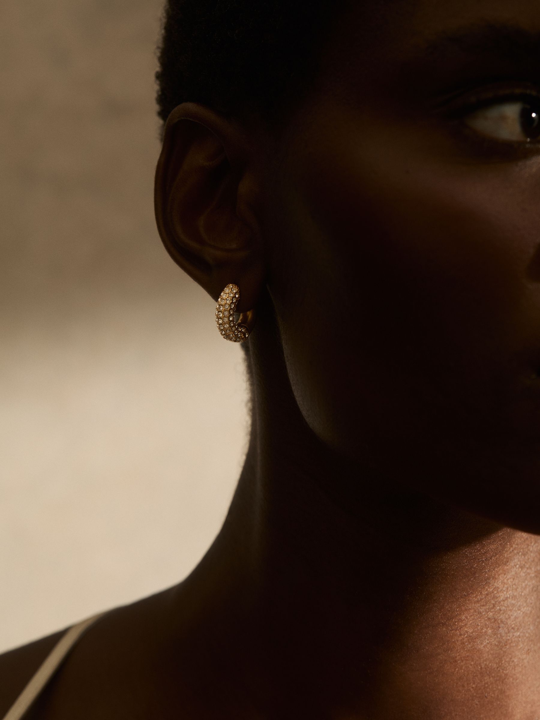 Pavé Huggie Earrings in Gold Tone - Image 5 of 6