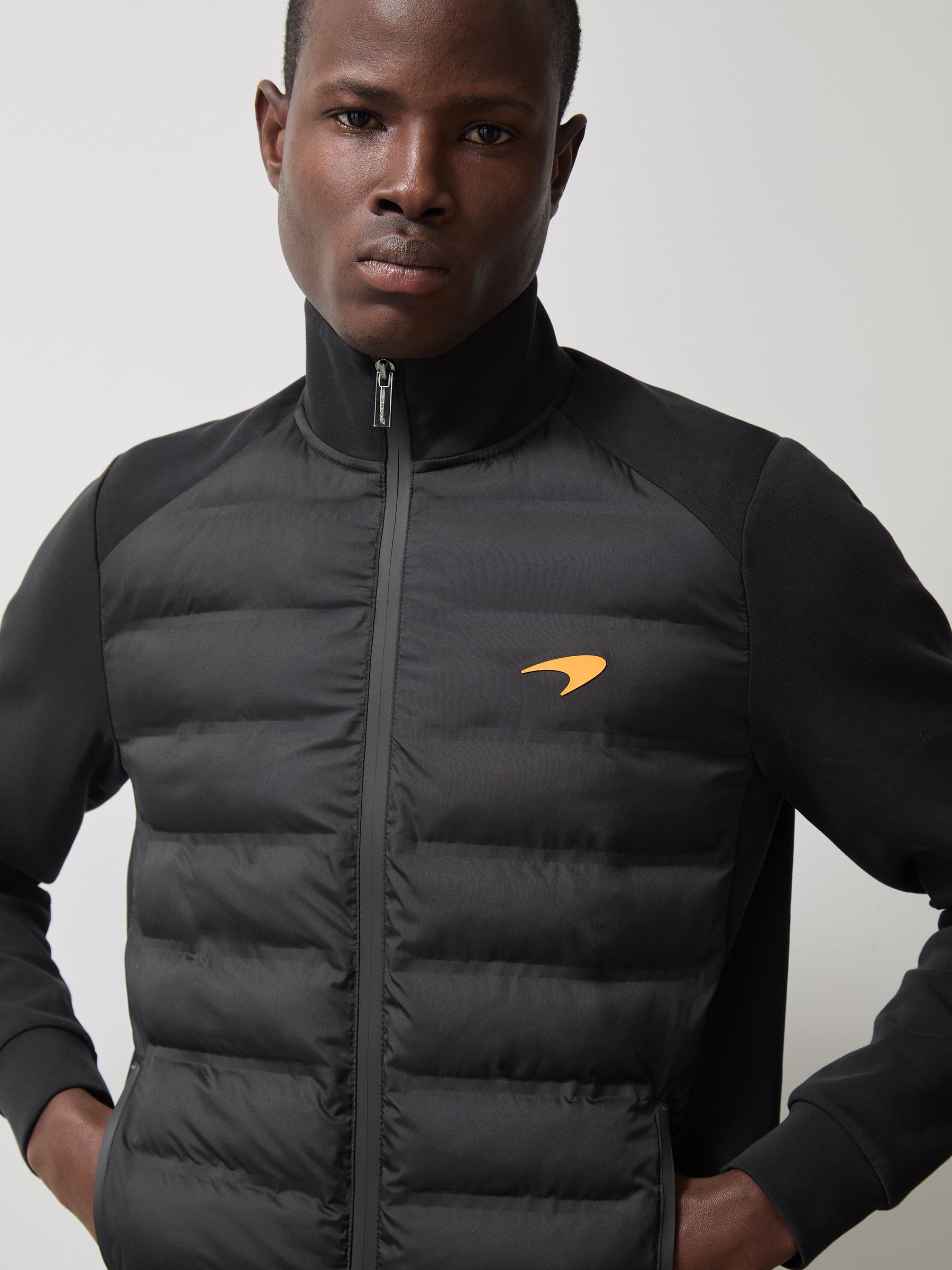 McLaren F1 Team Quilted Hybrid Jacket in Black - Image 1 of 8 McLaren F1 Team Quilted Hybrid Jacket in Black - Image 1 of 8
